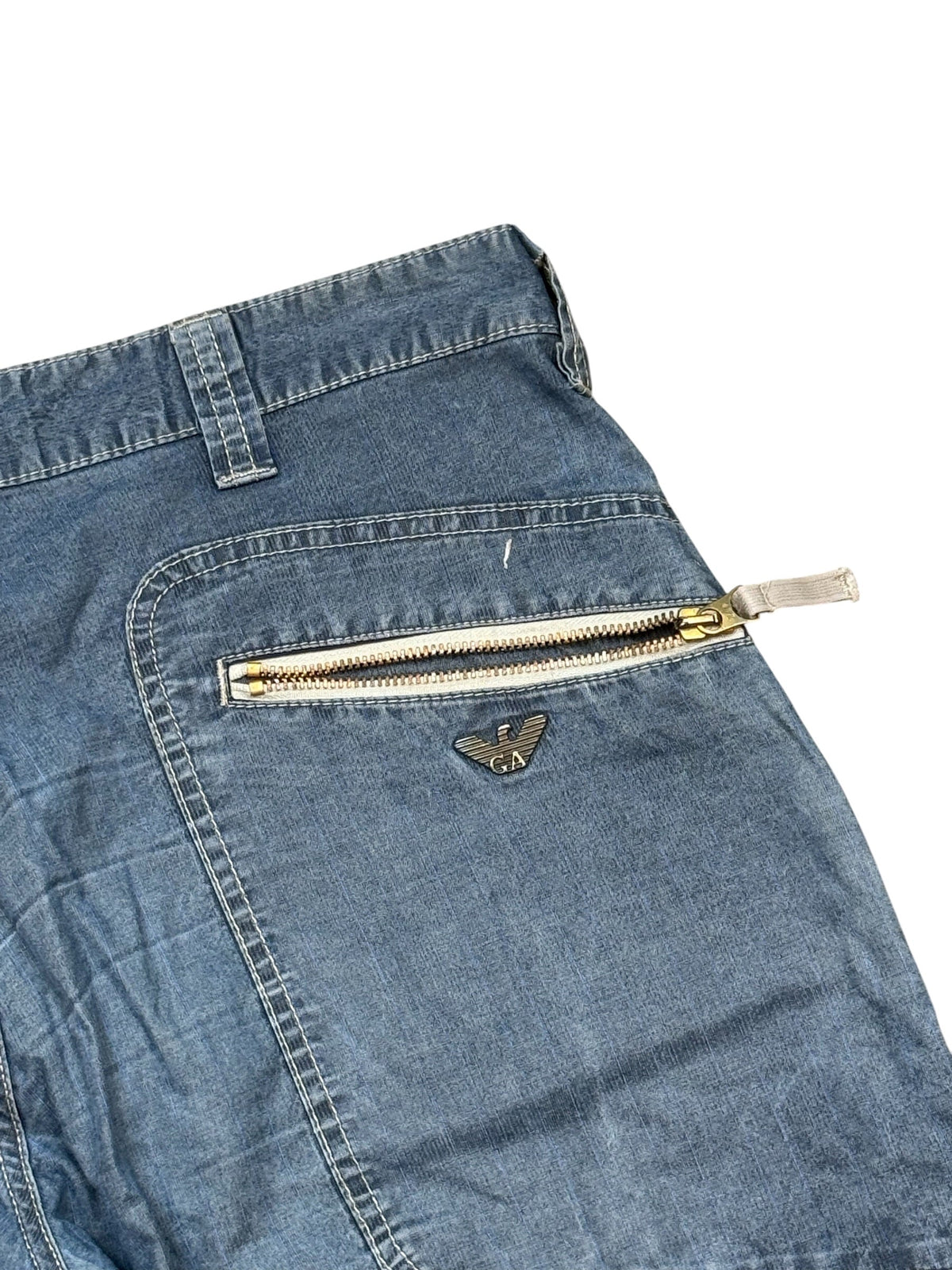 Archive No.9 vintage Armani navy denim shorts featuring a silver logo badge and a zippered back pocket.