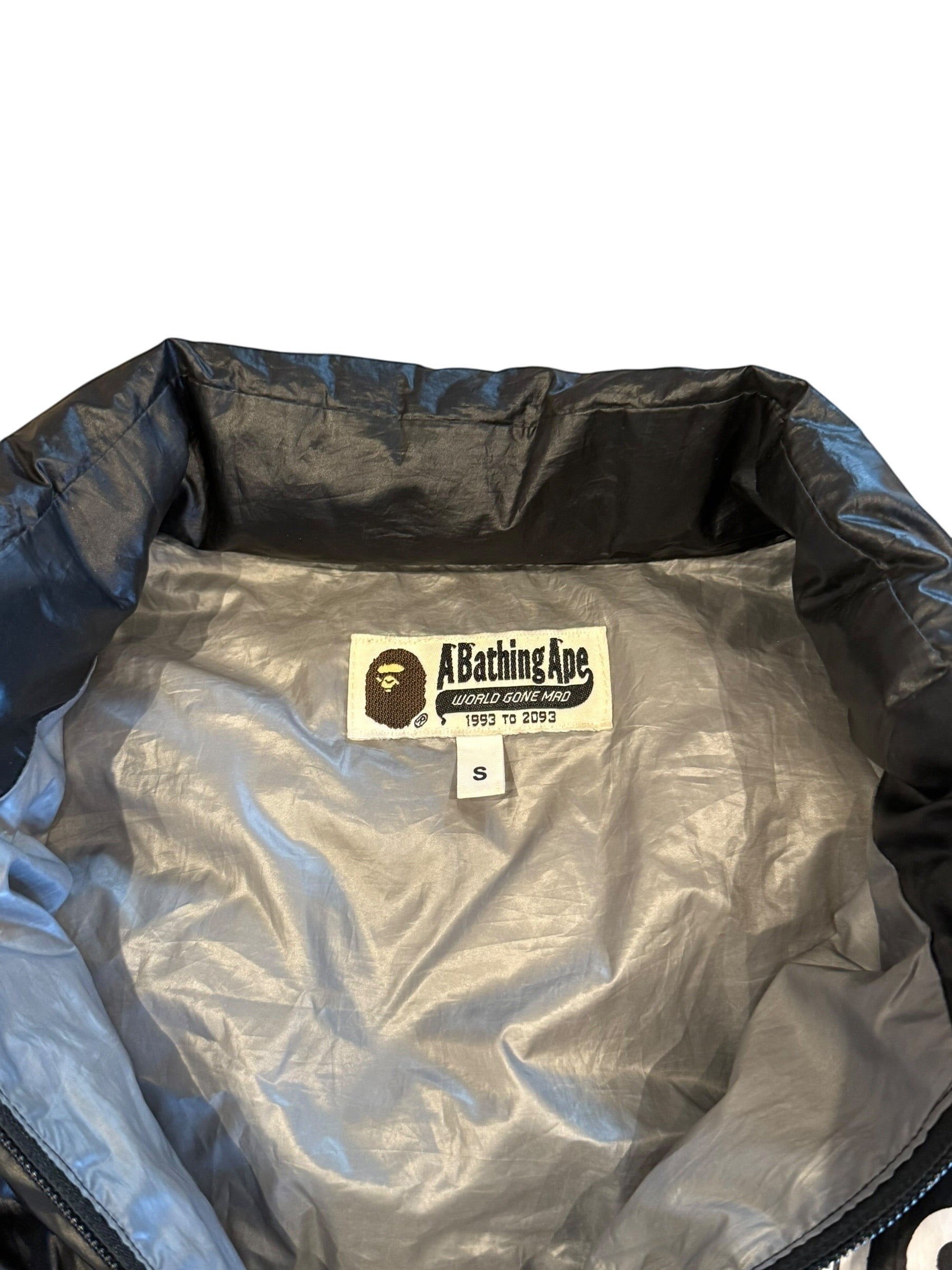 Archive No. 9 A Bathing Ape grey and black down-filled puffer jacket, size Small. Lightweight and wind-resistant.