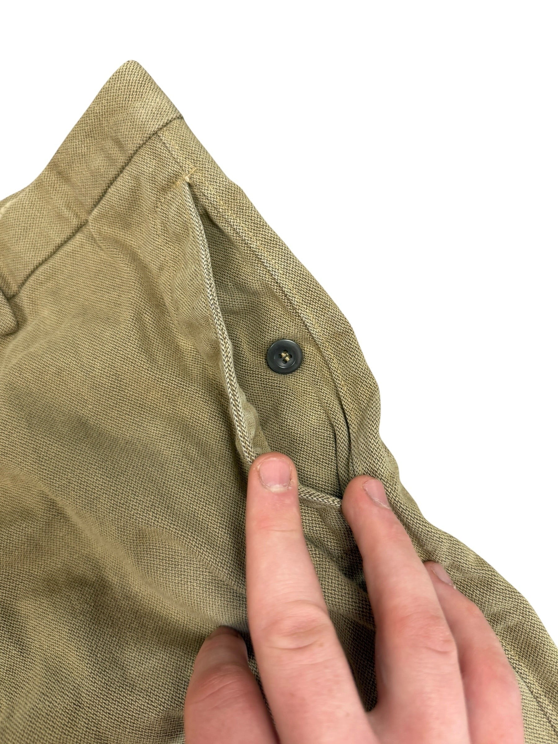 Archive No. 9 beige woven denim trousers with button-up pockets and a straight leg fit. Vintage styling.