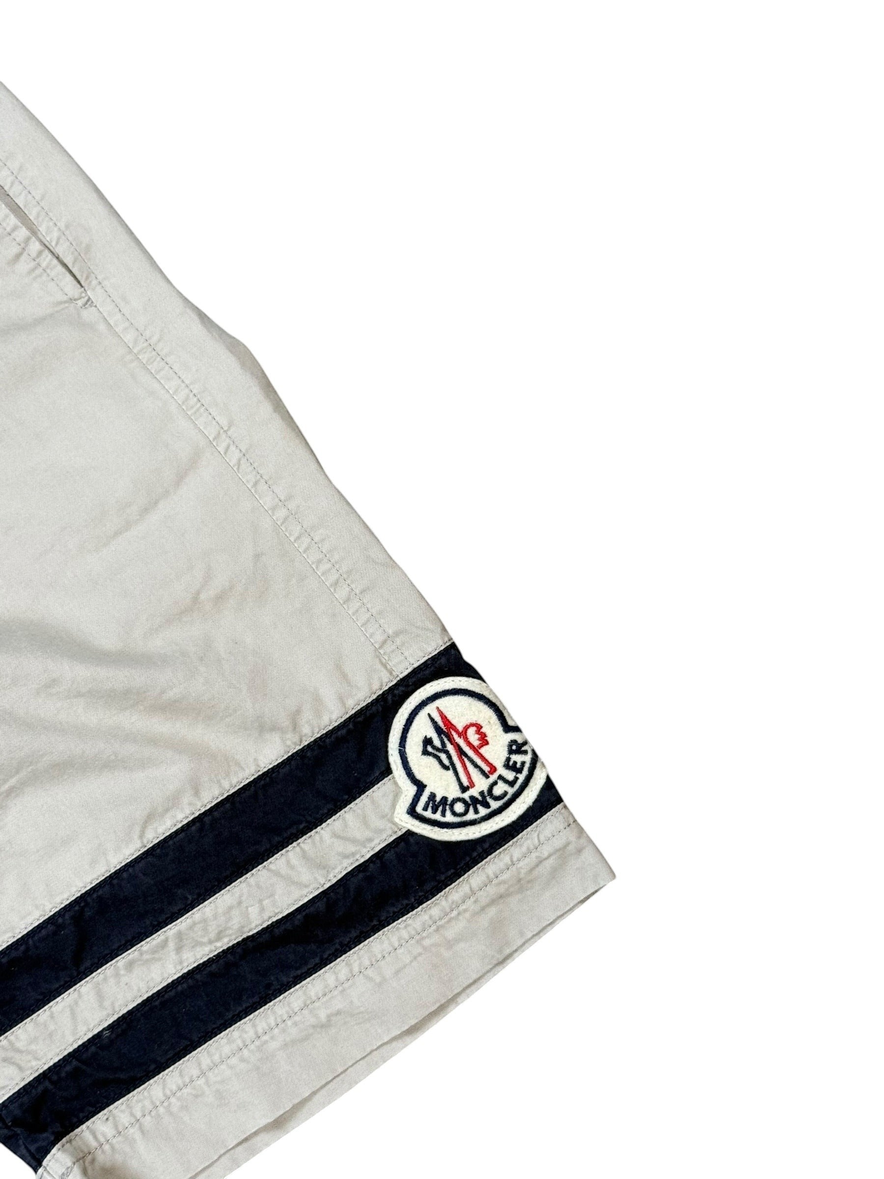 Archive No. 9 beige 100% cotton Moncler shorts with navy stripes and iconic Moncler badge on leg, size XS.