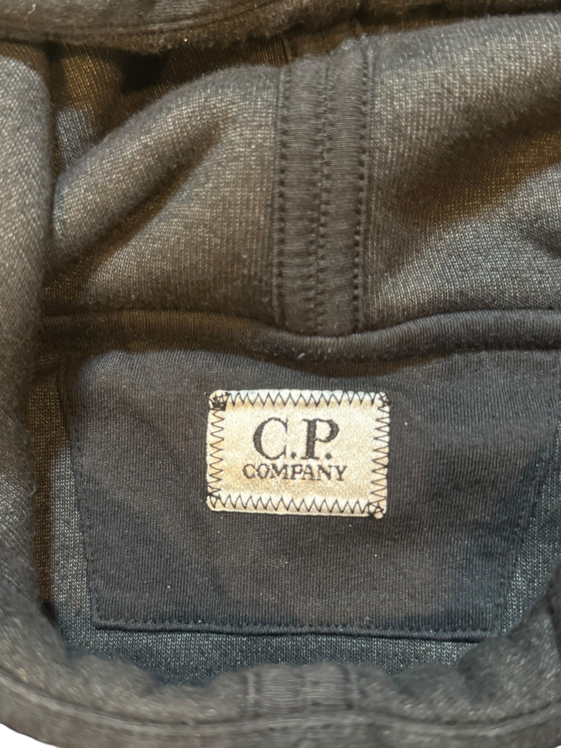 Archive No. 9 black fleeced cotton C.P. Company hoodie with iconic arm badge, size Medium.