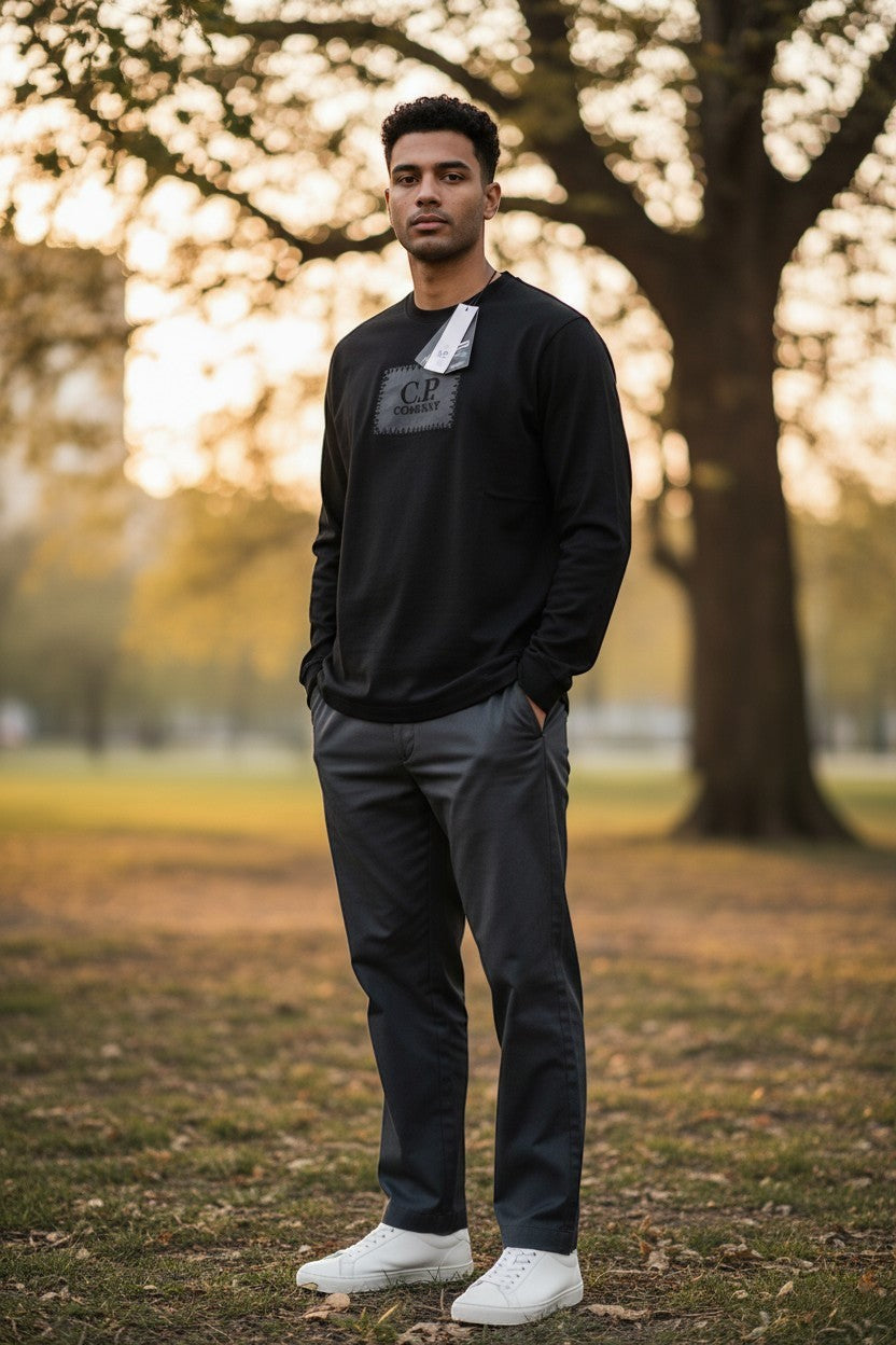 Archive No. 9 black 100% cotton C.P. Company long sleeve T-Shirt with logo detail on chest, size S.