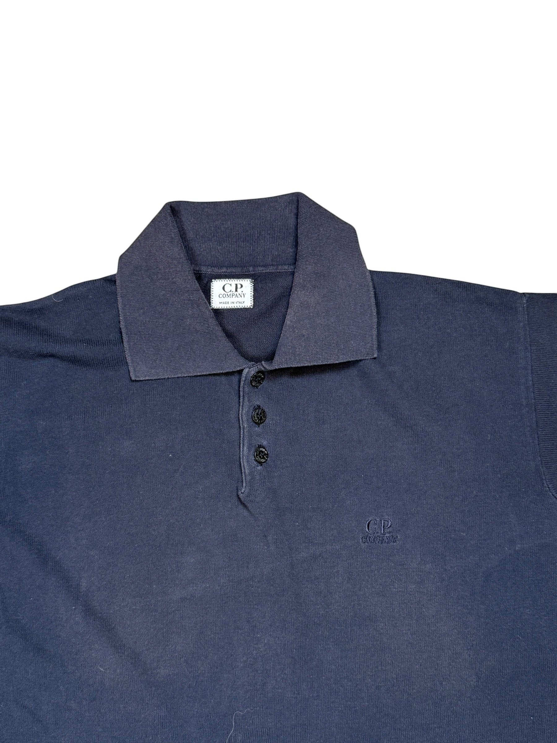 Archive No. 9 vintage C.P. Company black cotton polo shirt with embroidered logo on chest and button placket. Size M.