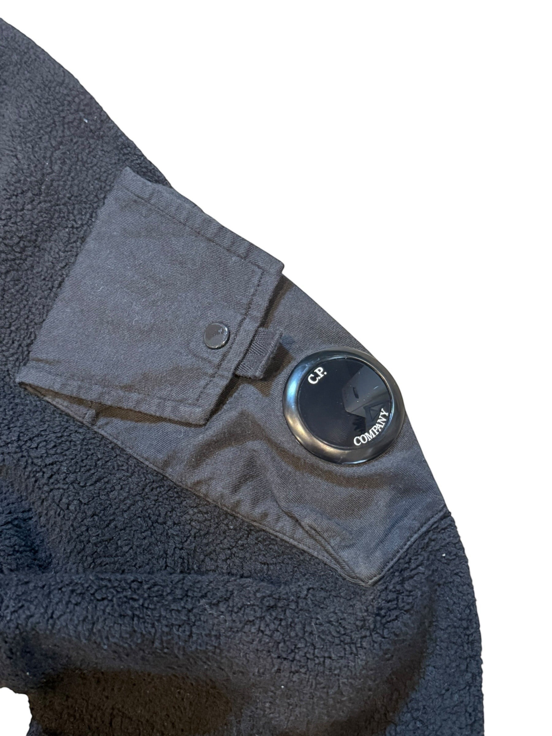 Archive No. 9 black fleeced hoodie with C.P. Company badge on arm, size Medium.