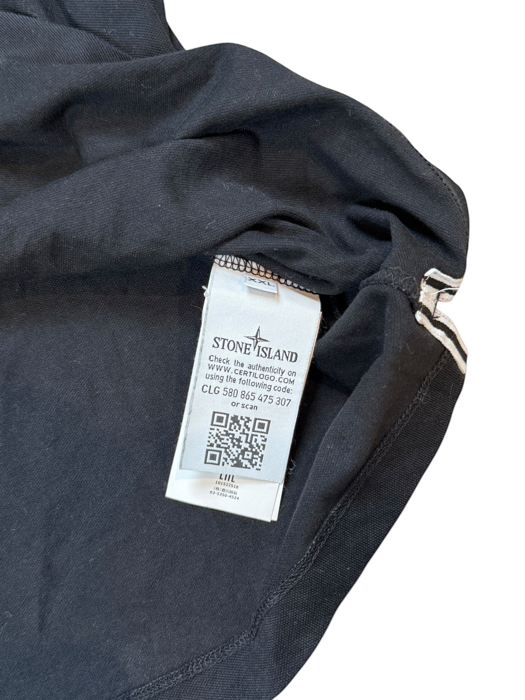 Archive No. 9 black cotton Stone Island polo shirt with iconic chest logo and striped cuffs, size XL.