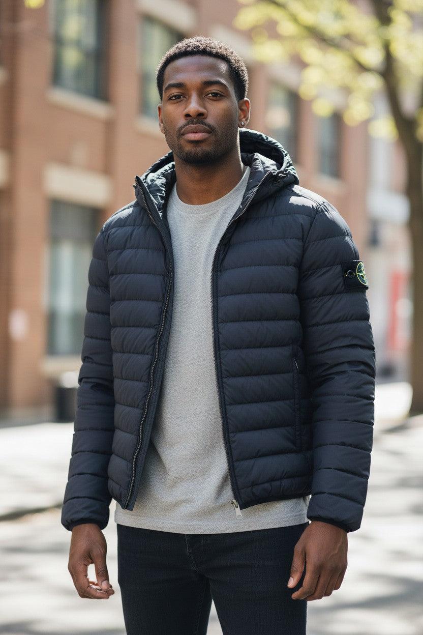 Archive No. 9 black Stone Island down-filled puffer jacket with hood, size Small. Lightweight and practical outerwear.