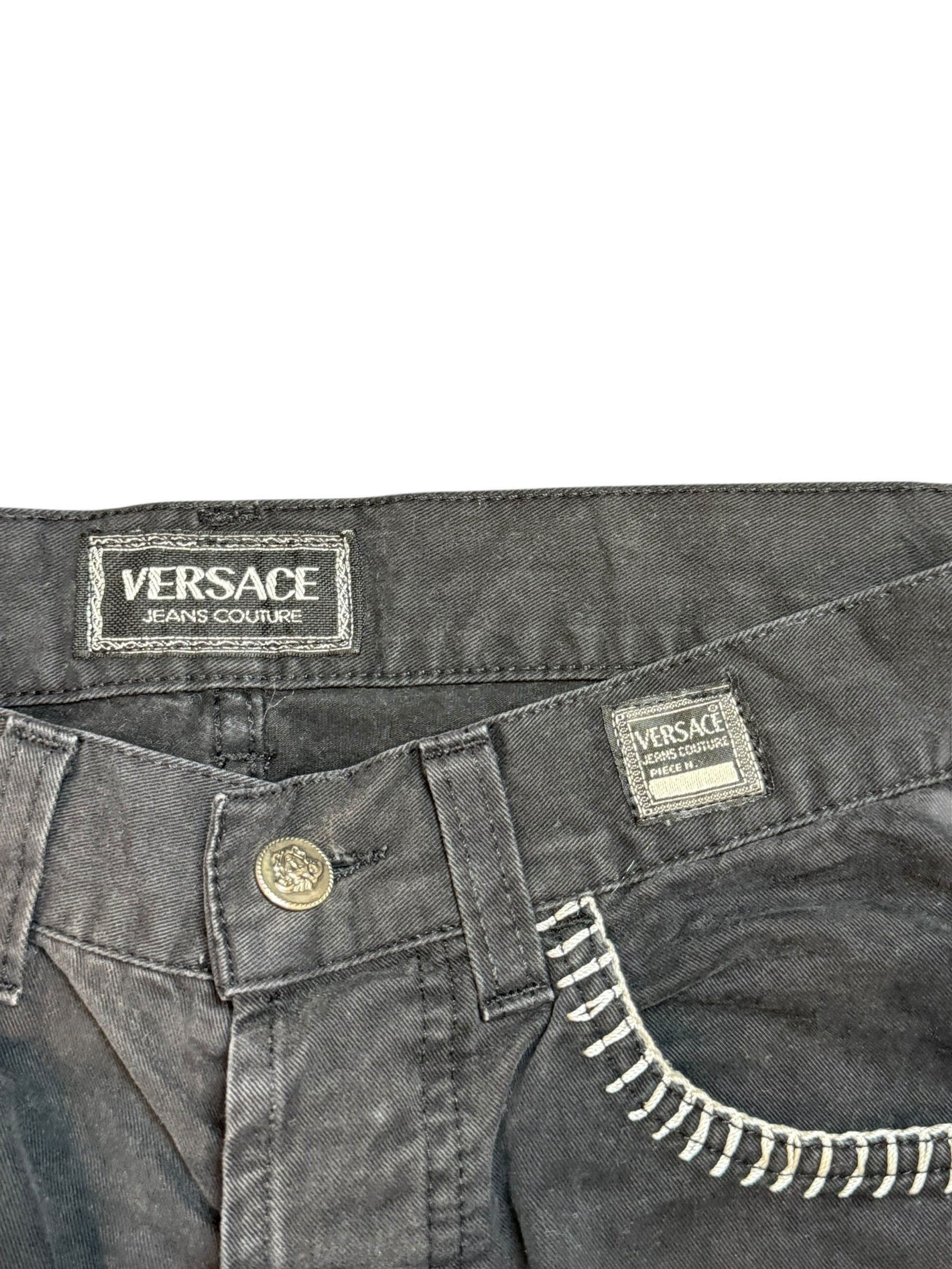 Archive No. 9 vintage black Versace Jeans Couture denim with chunky white stitching detail on pocket and iconic branding.