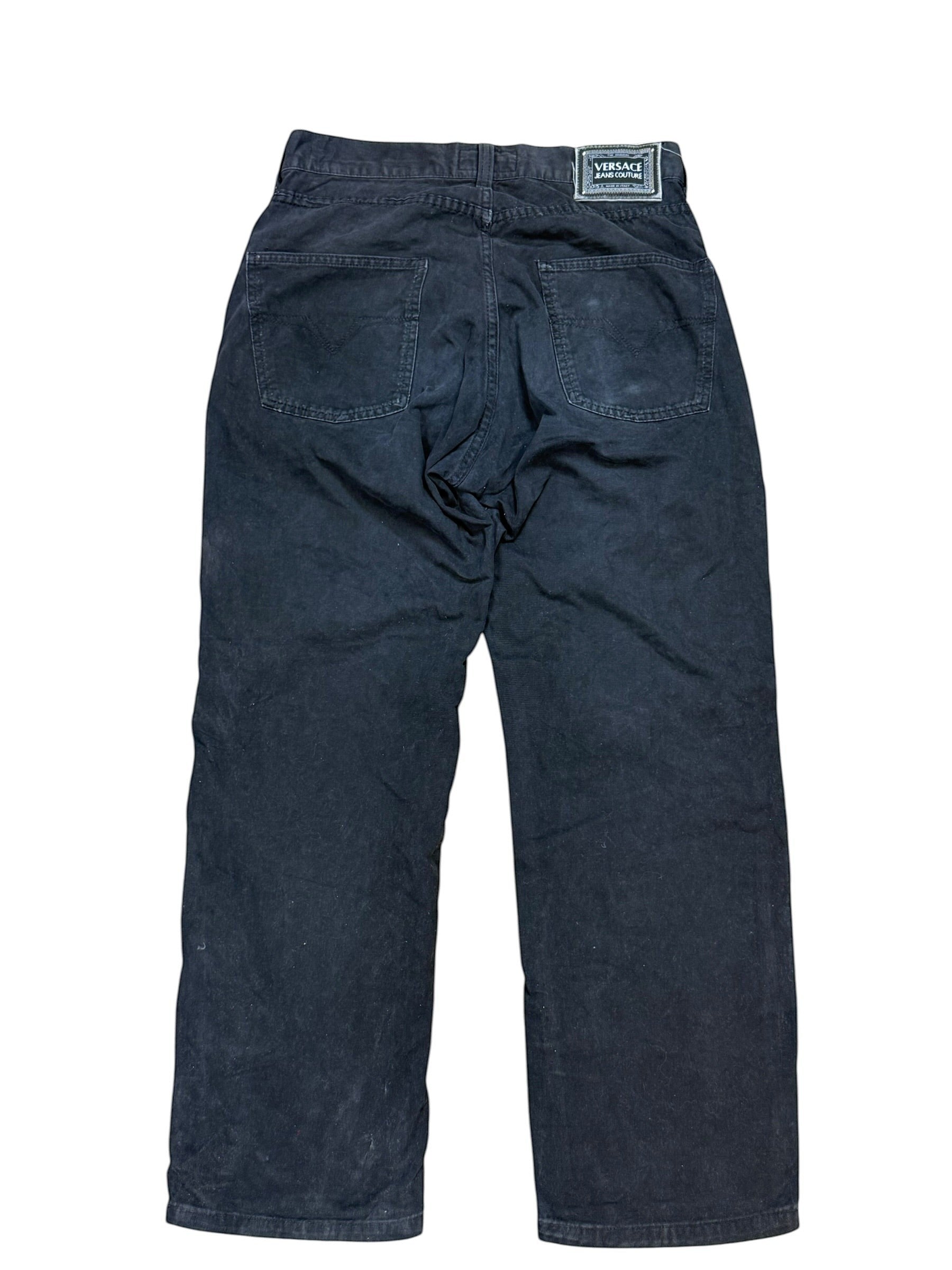 Archive No. 9 vintage black Versace Jeans Couture corduroy trousers, size W32, featuring classic five-pocket styling and a leather logo patch.