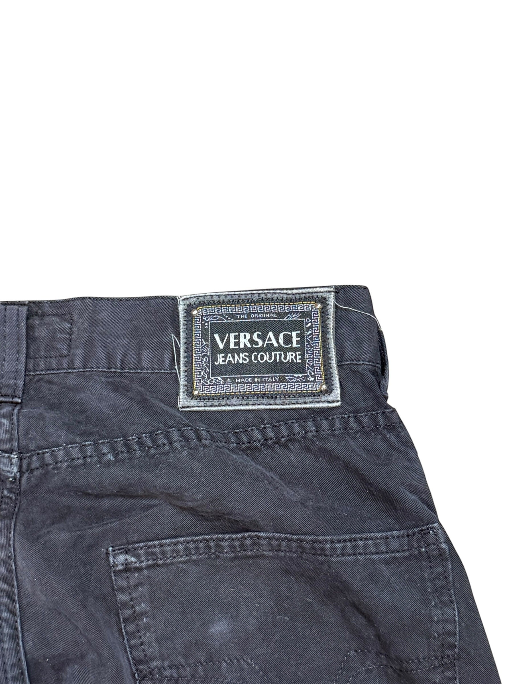 Archive No. 9 vintage black Versace Jeans Couture denim with iconic branding and distressed details.
