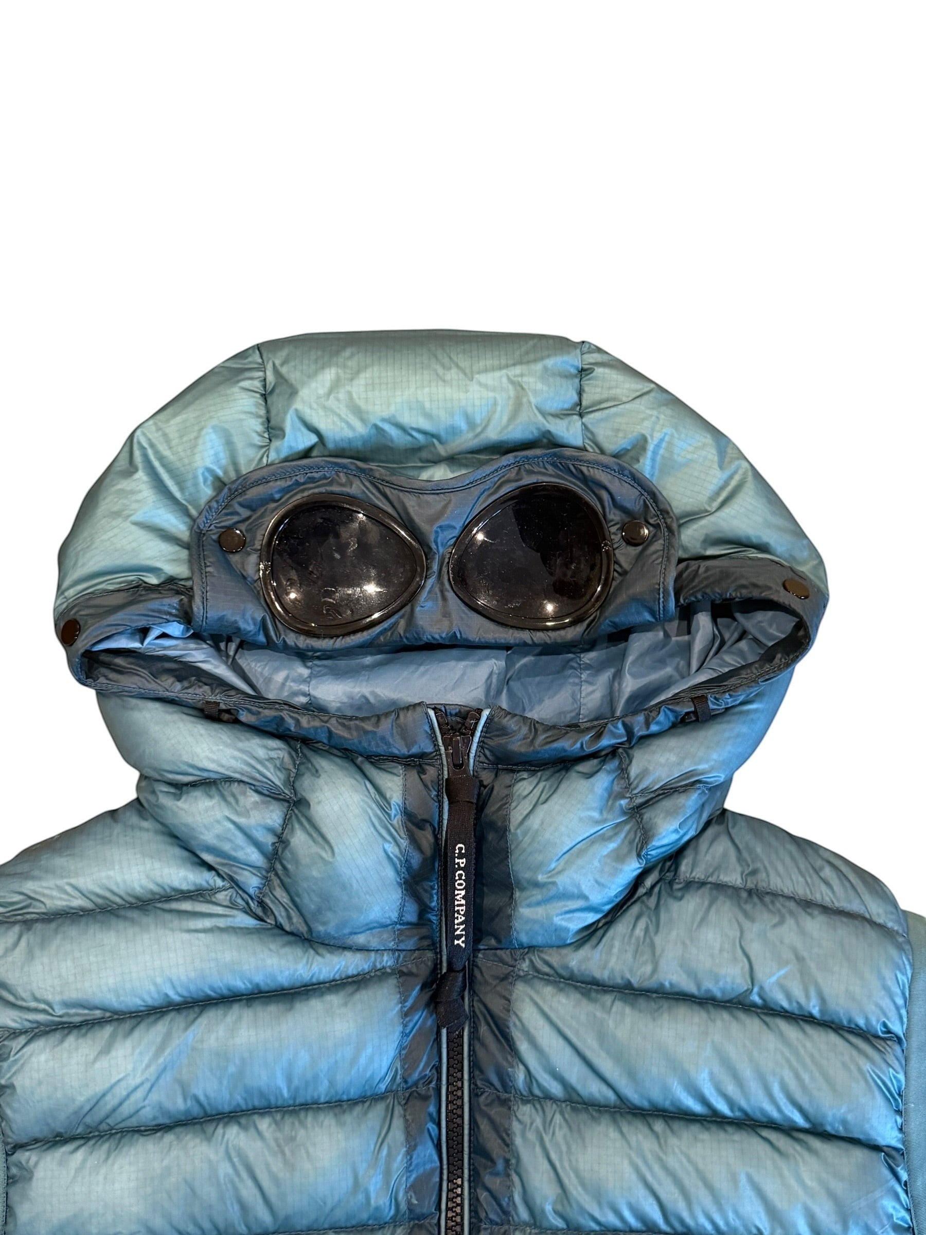 Archive No. 9 C.P. Company blue hooded DD Shell puffer body warmer with signature goggles detail. Size L.
