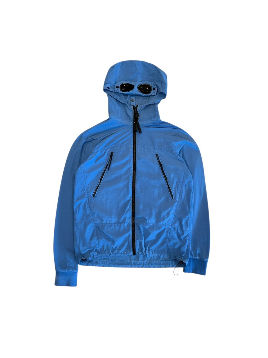 Archive No. 9 blue C.P. Company lightweight windbreaker jacket with hood and goggles detail, size S.