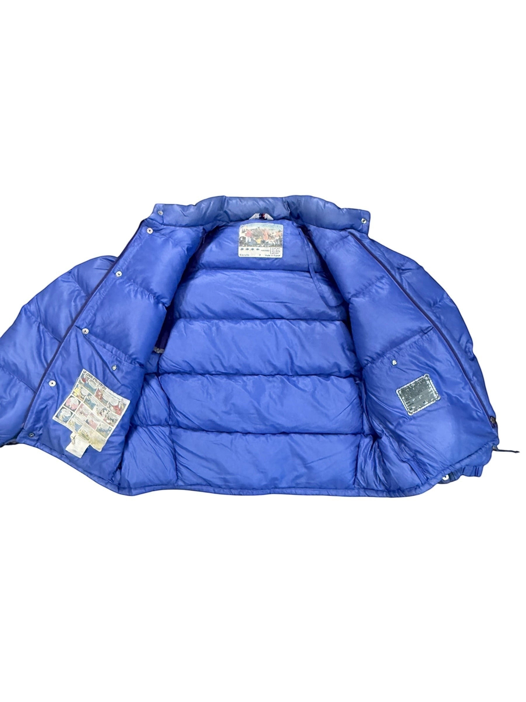 Archive No. 9 vintage blue down-filled Moncler puffer jacket, size Large. Features classic quilted design.