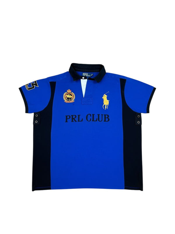 Archive No. 9 blue short-sleeve polo shirt with black side panels and a large yellow horse logo. Features "PRL CLUB" text and a crest.