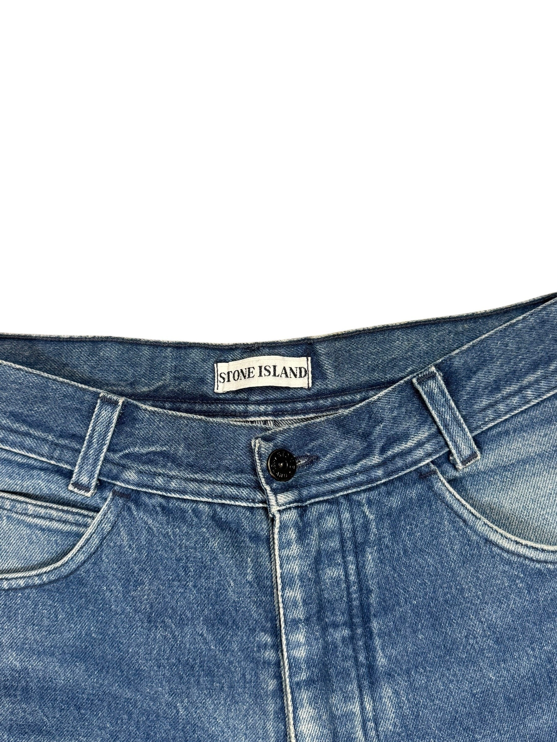 Archive No. 9 vintage blue denim jeans, size W30, featuring a straight-leg fit and the iconic green edge Stone Island badge on the back pocket.