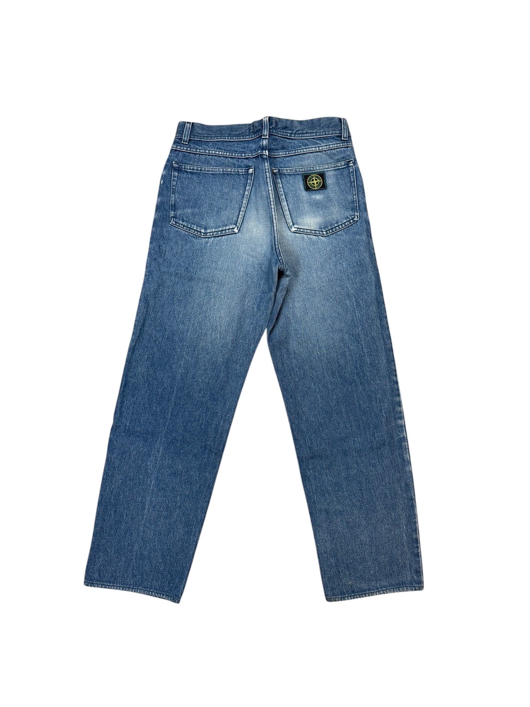 Archive No. 9 vintage blue denim jeans with a green edge Stone Island badge on the back pocket, size W30.