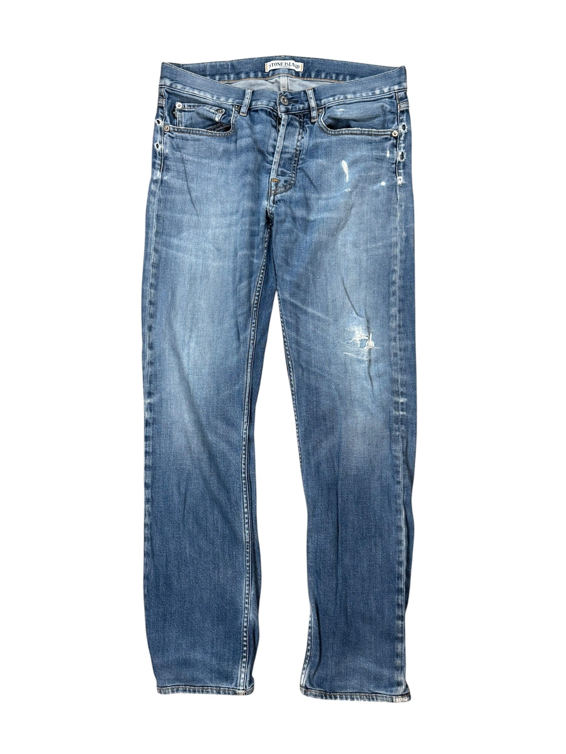 Archive No. 9 vintage blue denim jeans, size W32, with a straight fit and distressed details. Features iconic Stone Island compass badge on back pocket.