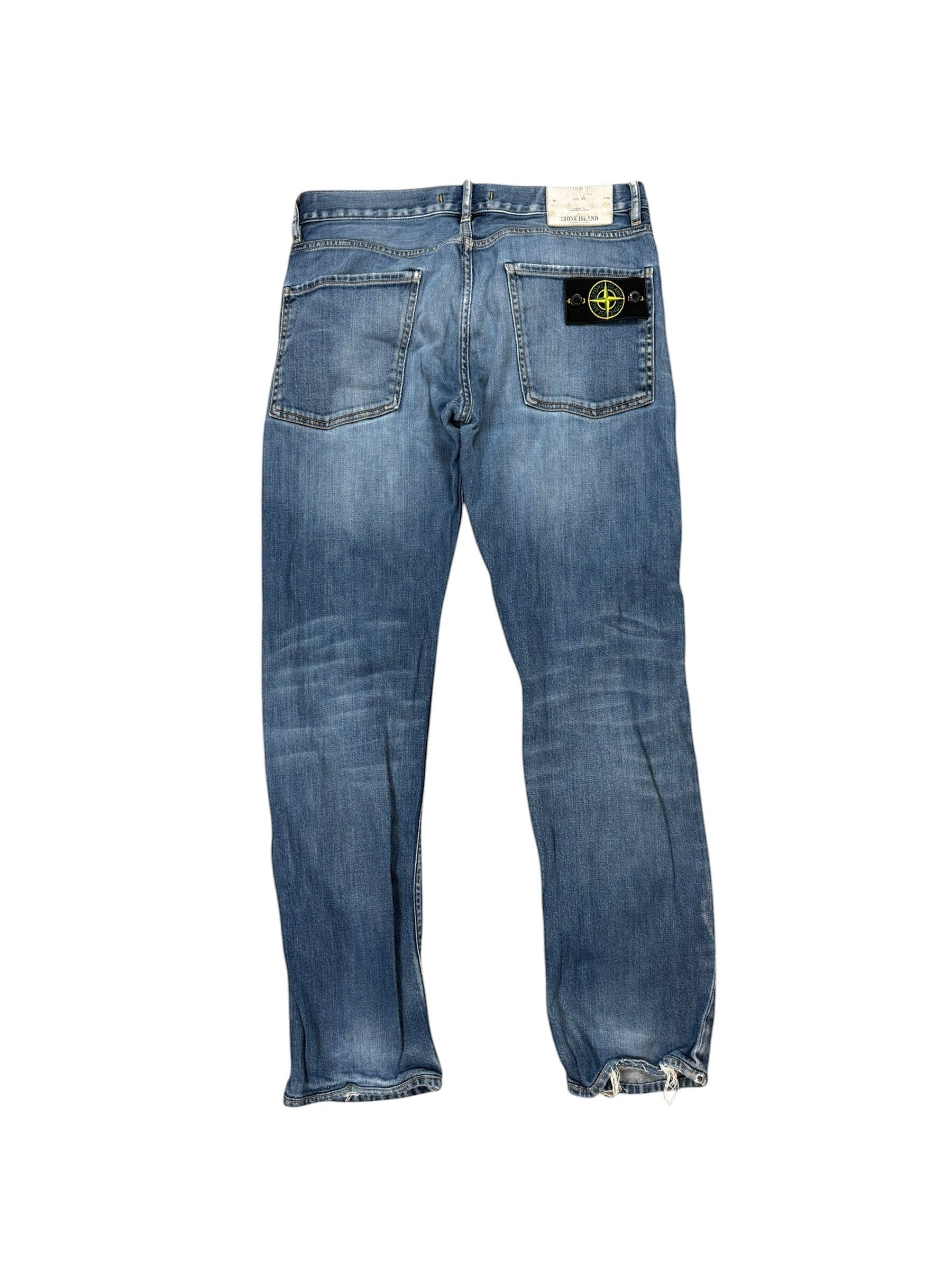 Archive No. 9 vintage blue denim jeans with straight fit and iconic Stone Island compass badge on back pocket. Size W32.