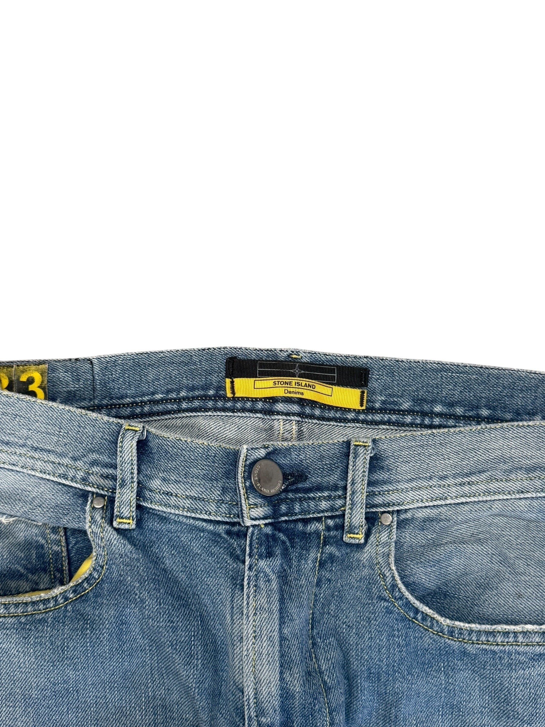 Archive No. 9 vintage blue 100% cotton Stone Island jeans, size W34, with branded buttons and straight cut fit.
