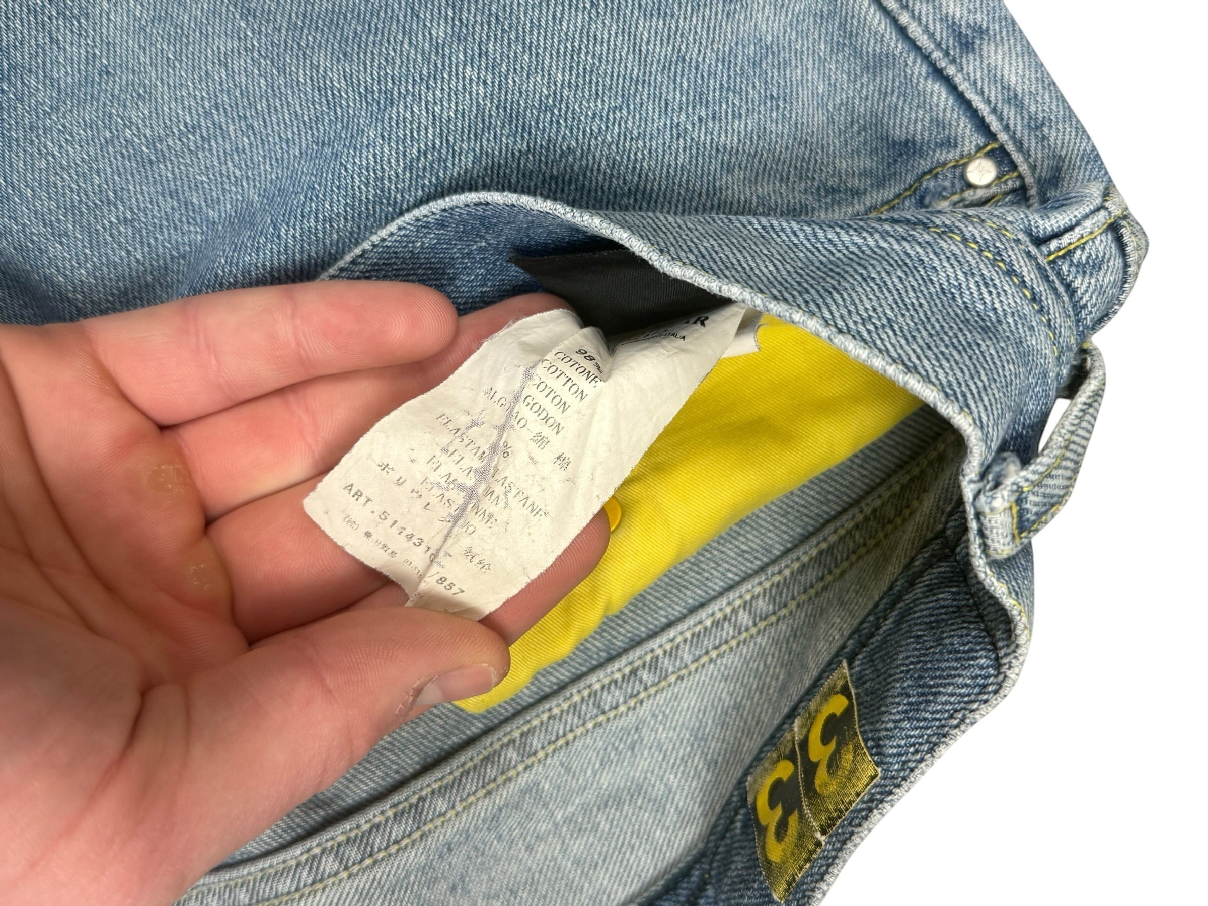 Archive No. 9 vintage blue 100% cotton Stone Island jeans, size W34, straight cut fit, with branded buttons and yellow pocket lining.