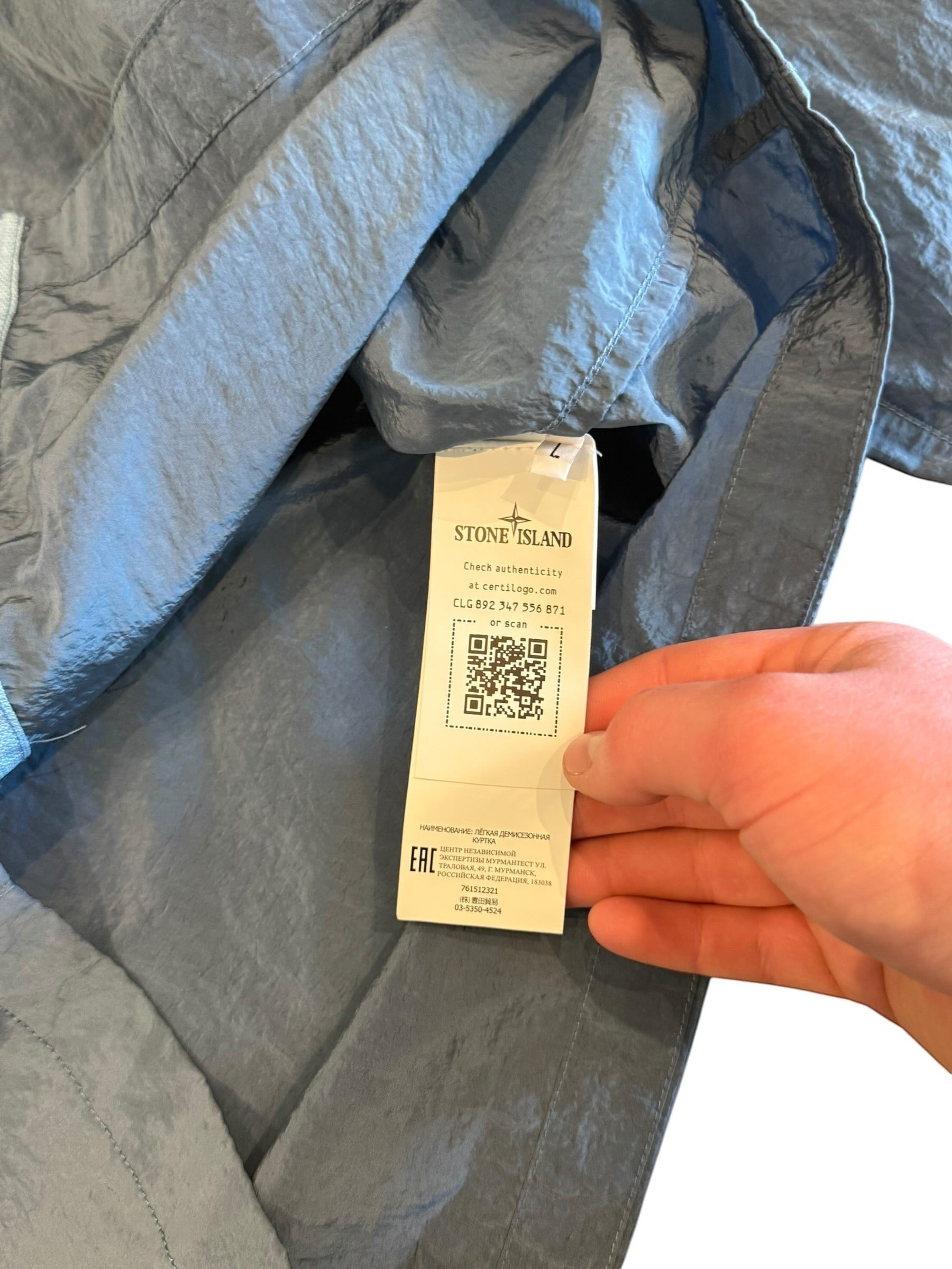 Archive No. 9 blue Stone Island lightweight nylon jacket, size L, with wind and water resistance.