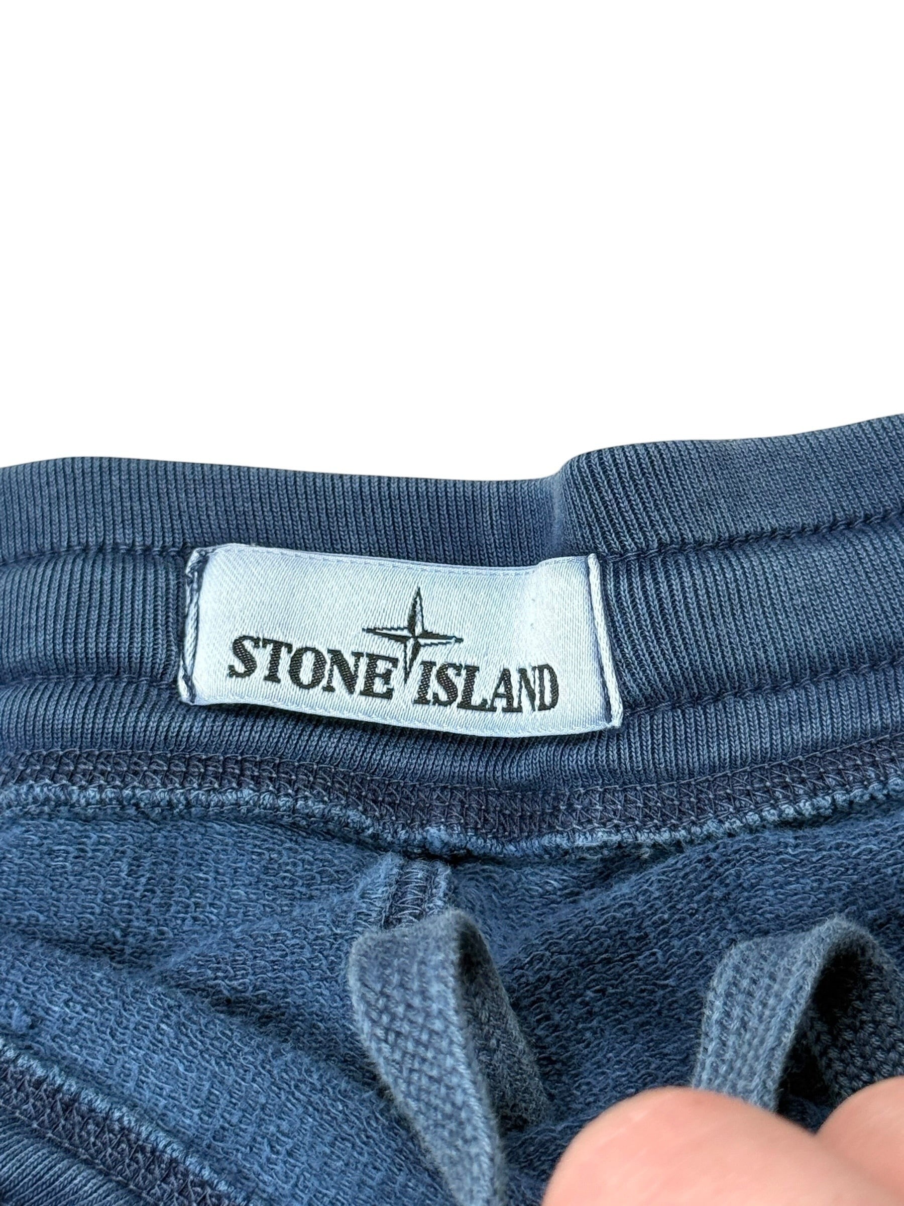 Archive No. 9 vintage blue 100% cotton Stone Island shorts with drawstring waist and compass logo detail.