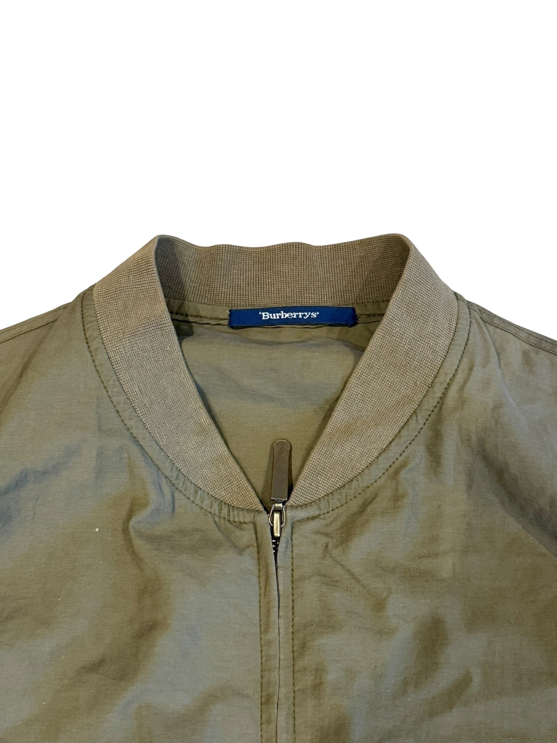 Archive No. 9 Burberry khaki lightweight bomber jacket, size Medium. Features a zip closure and ribbed collar.