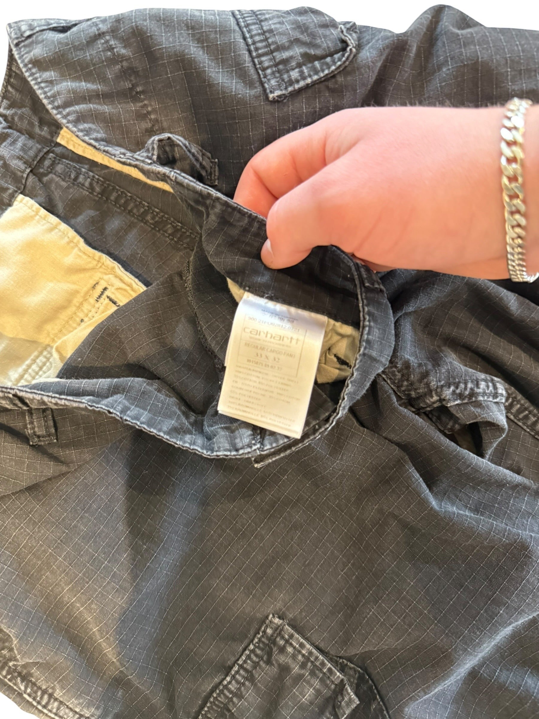Archive No. 9 Carhartt black regular fit cargo pants with multiple pockets and a durable, lightweight construction.