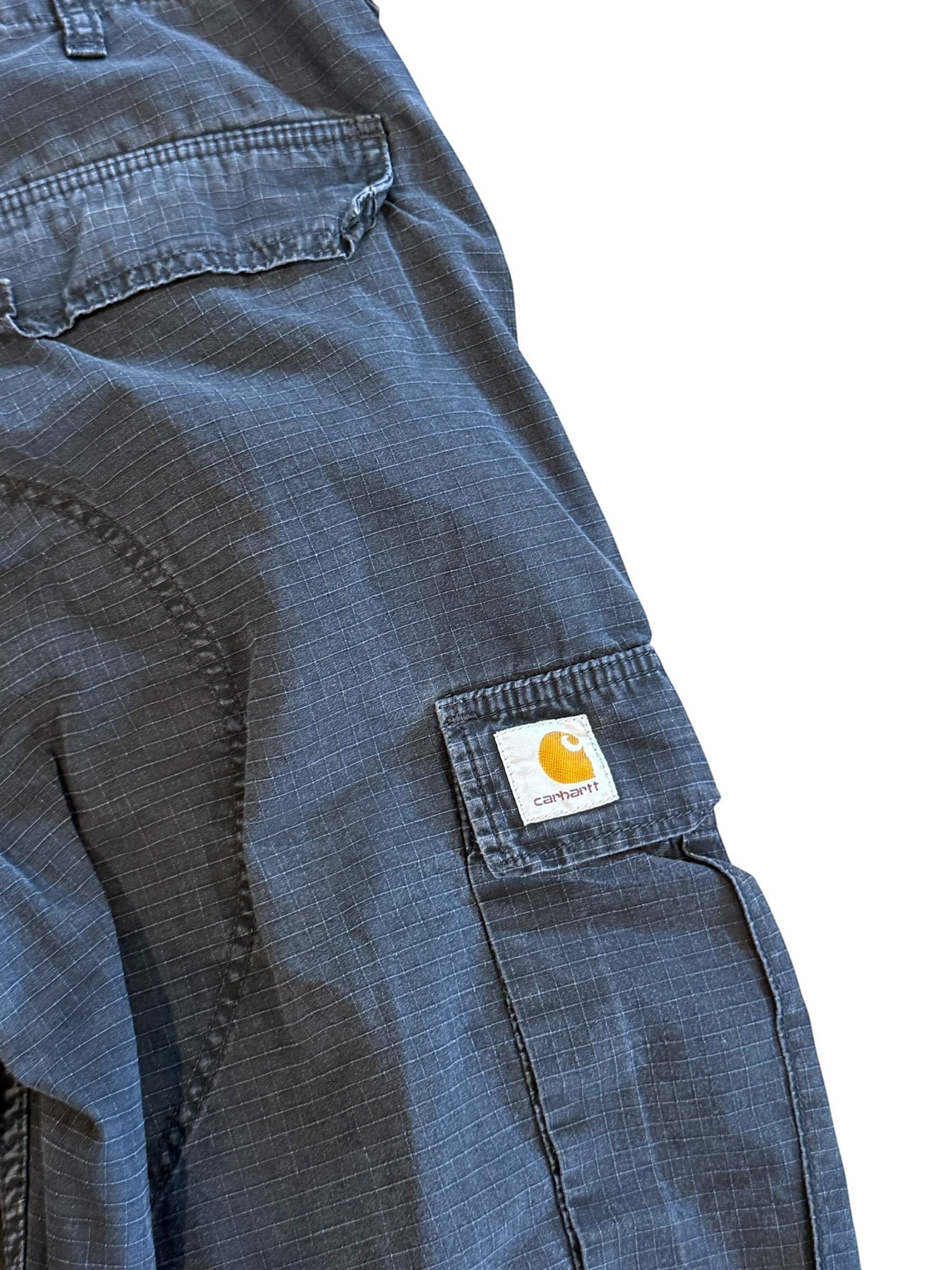Archive No. 9 Carhartt black regular fit cargo pants with multi-pocket design and durable lightweight construction.