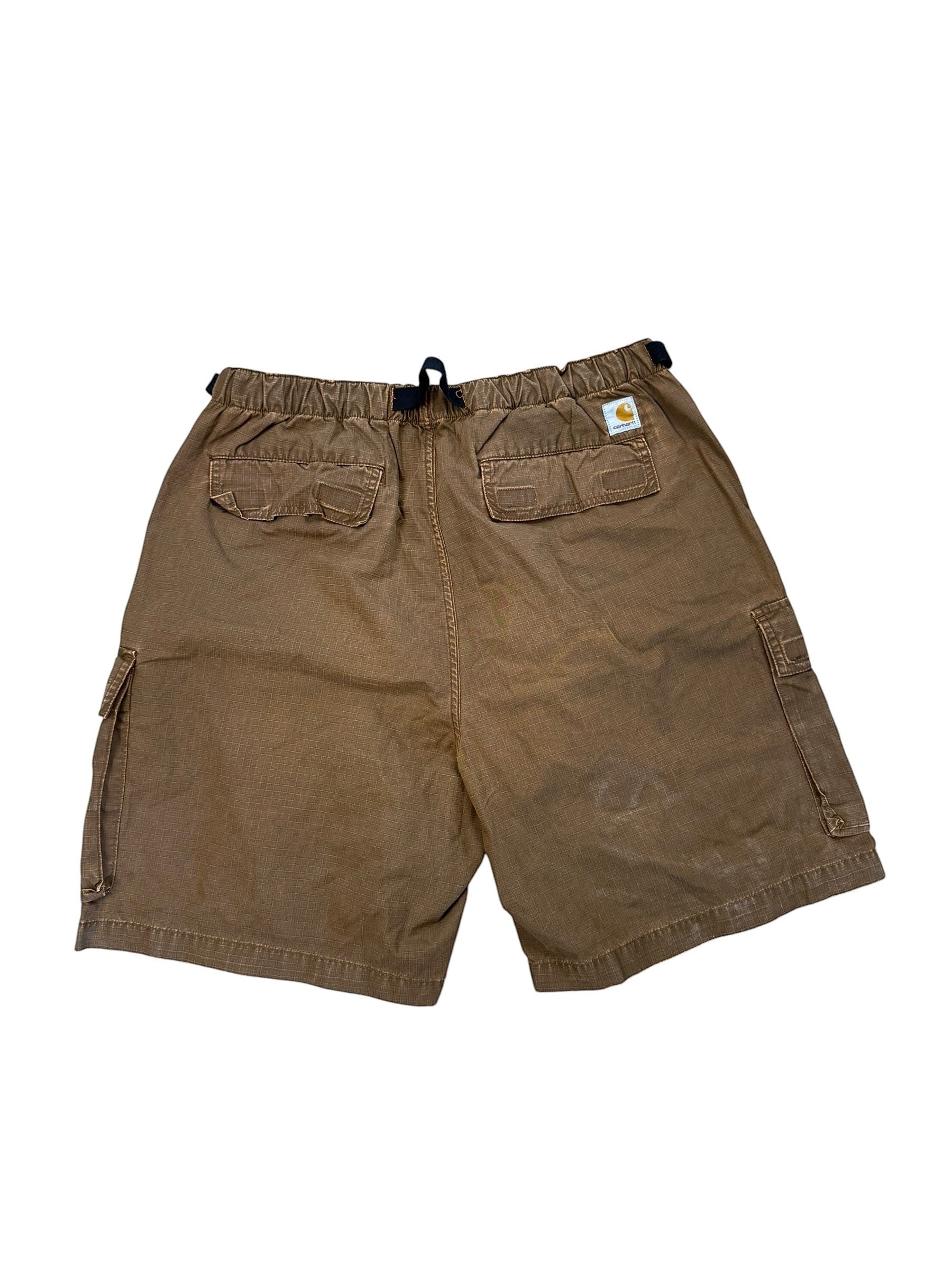Archive No. 9 Carhartt brown technical cargo shorts with adjustable buckle and multiple pockets.