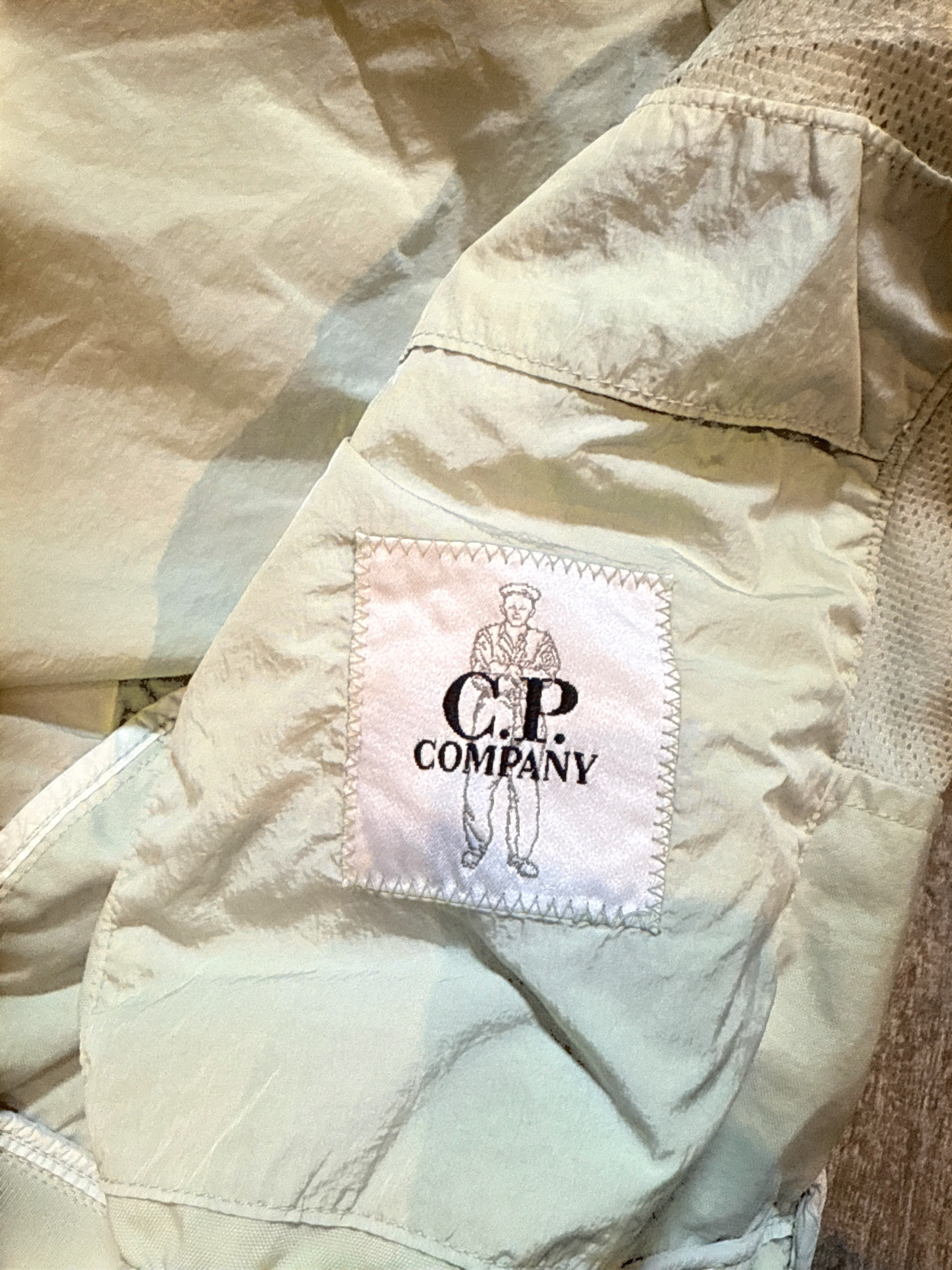 Archive No. 9 C.P. Company beige/cream bomber jacket in Chrome-R, size Medium. Lightweight, wind-resistant, and waterproof.