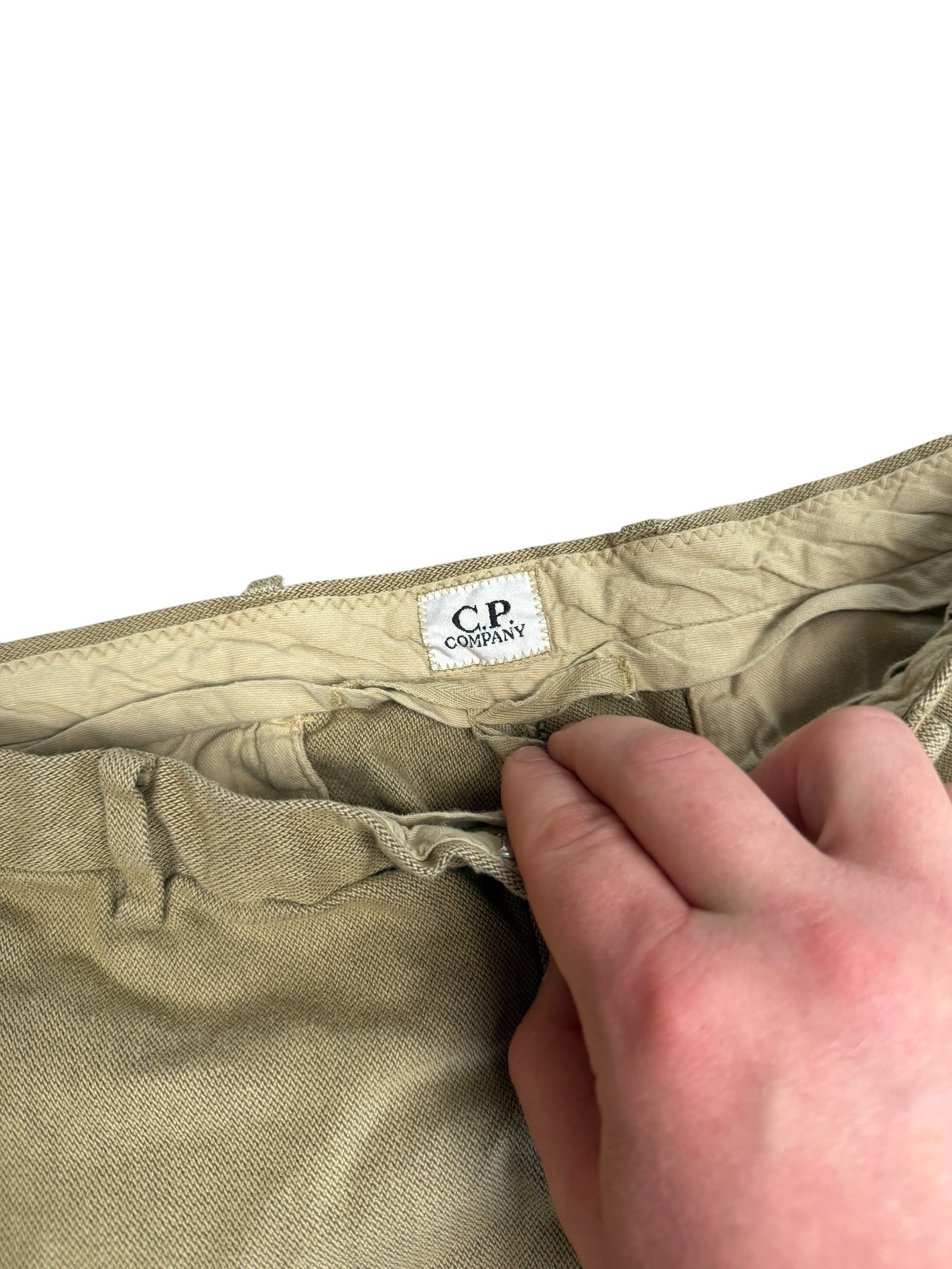 Archive No.9 C.P. Company beige woven denim trousers with button-up pockets and a straight leg fit.