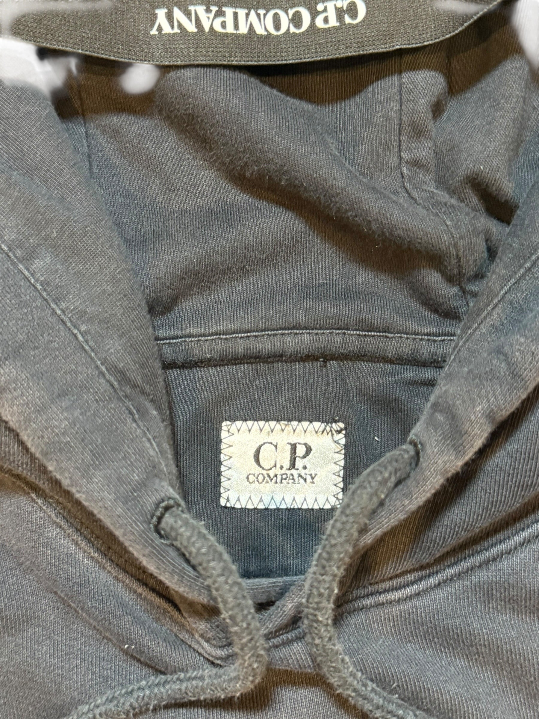 Archive No. 9 C.P. Company black cotton hoodie with logo on hood and lens detail on arm. Size Small.
