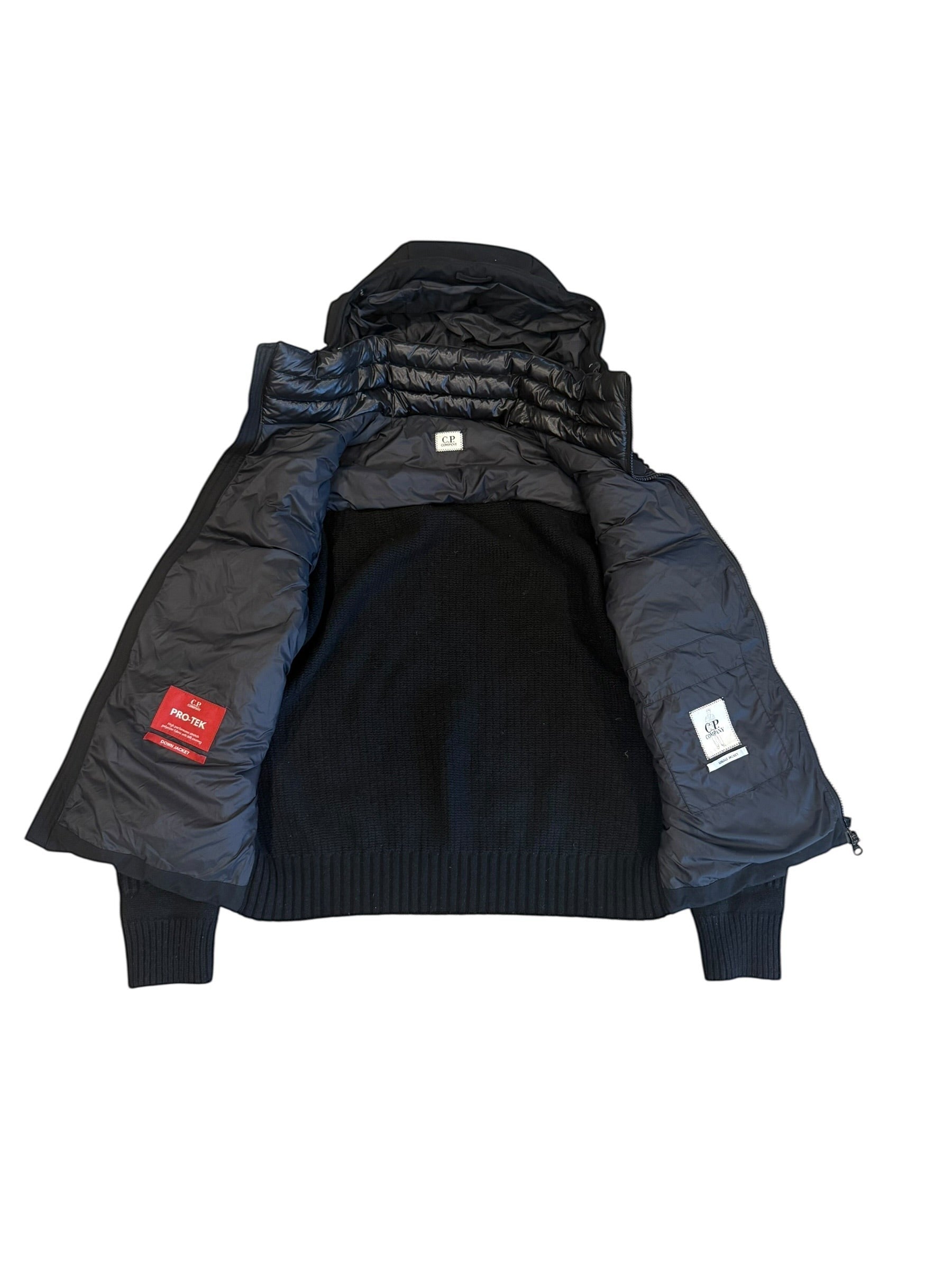 Archive No. 9 C.P. Company black hybrid jacket with detachable hood, 50/50 knit and down puffer design.