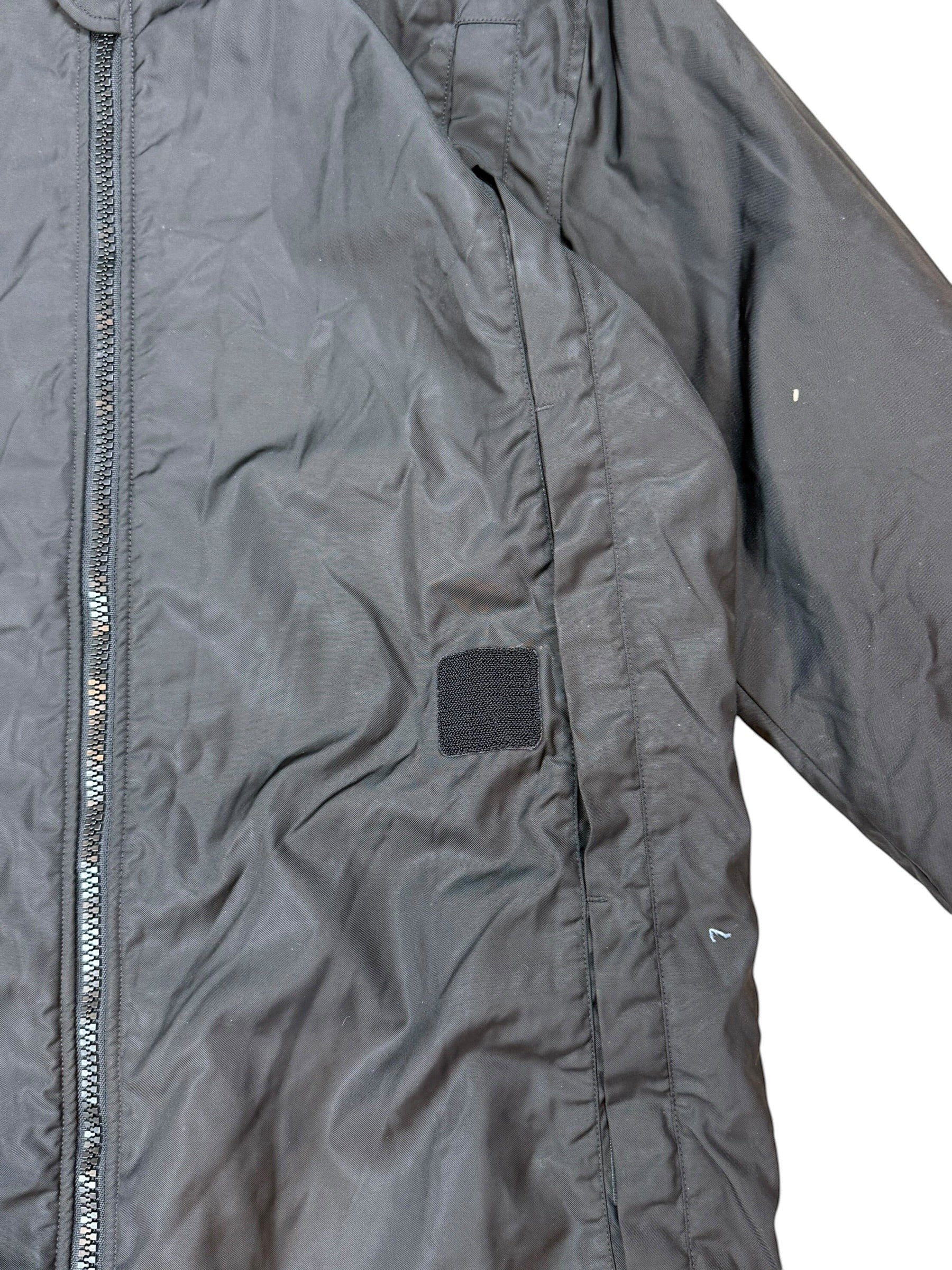 Archive No. 9 black C.P. Company technical 2002 vintage parka jacket, size L, with zip closure and velcro patch detail.
