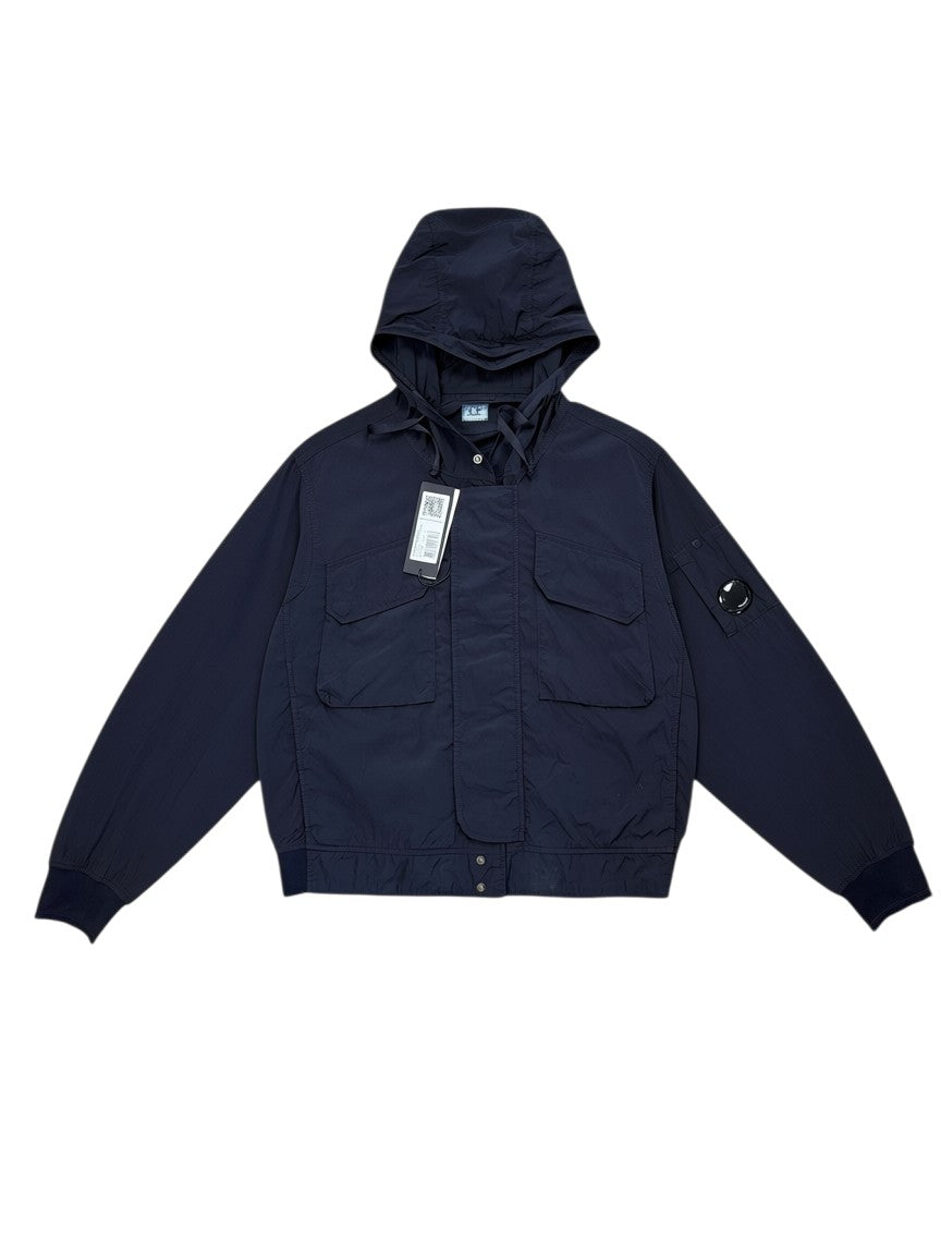 Archive No. 9 black C.P. Company Chrome R utility windbreaker jacket with hood, multiple pockets, and signature lens detail on sleeve. Size L.