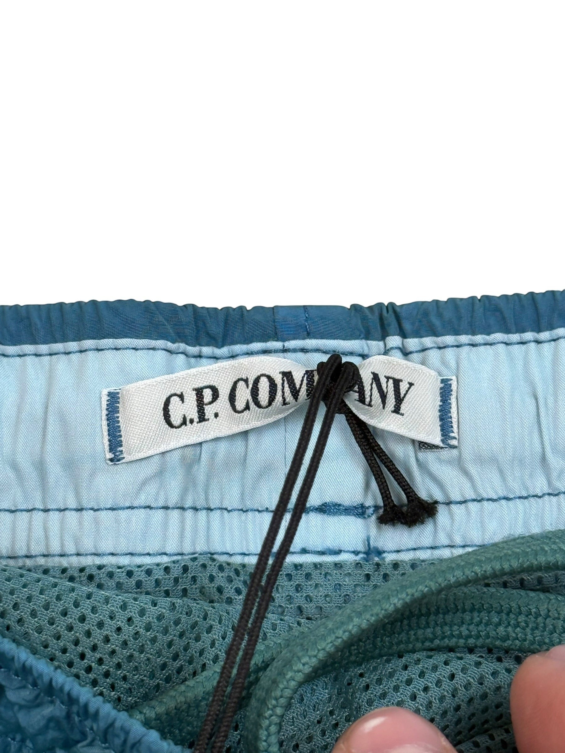 Archive No. 9 C.P. Company blue Chrome-R shorts with mesh lining and drawstring waist. Regular fit, size M / W32.