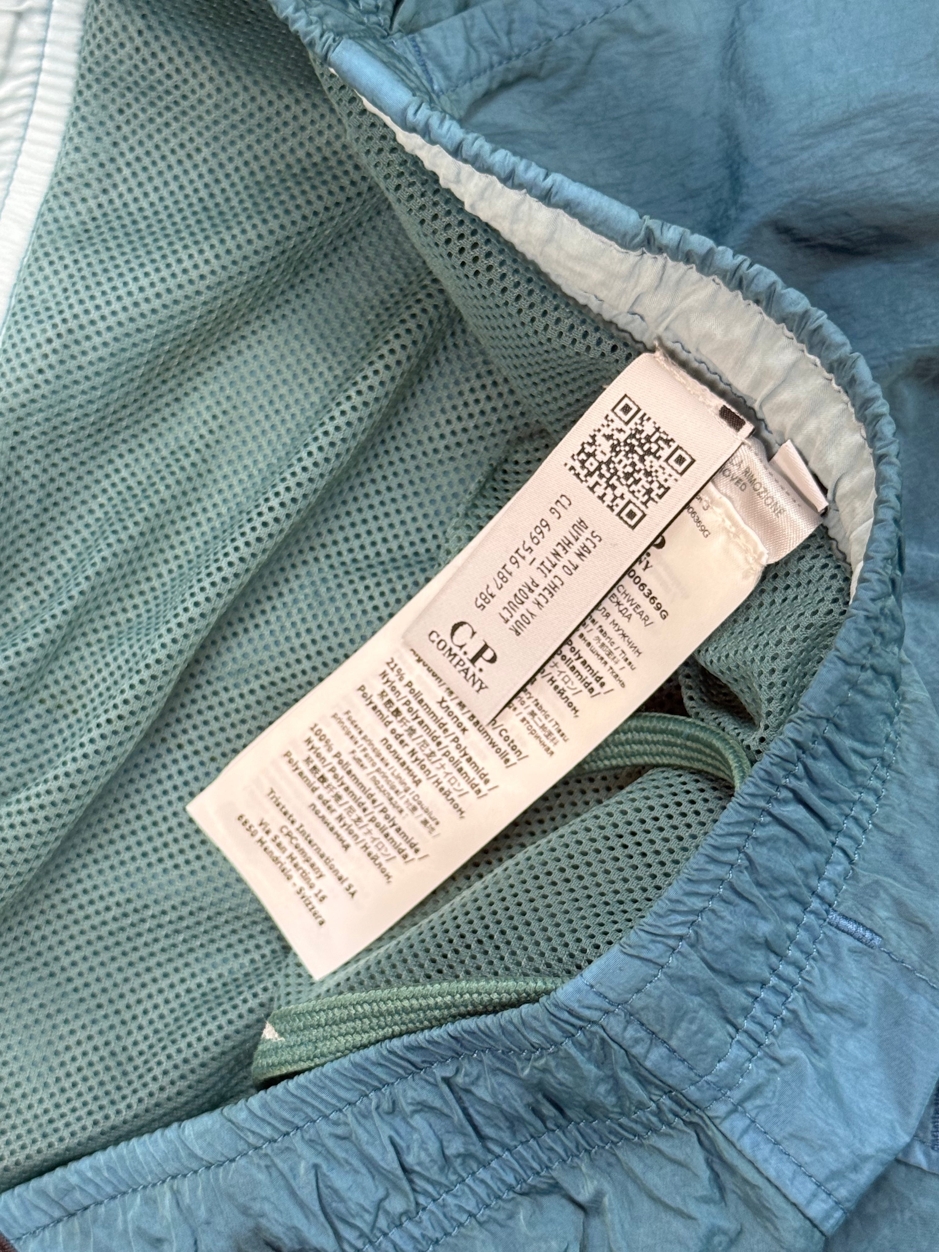 Archive No.9 blue C.P. Company Chrome R shorts with mesh lining and drawstring waist. Size M / W32.