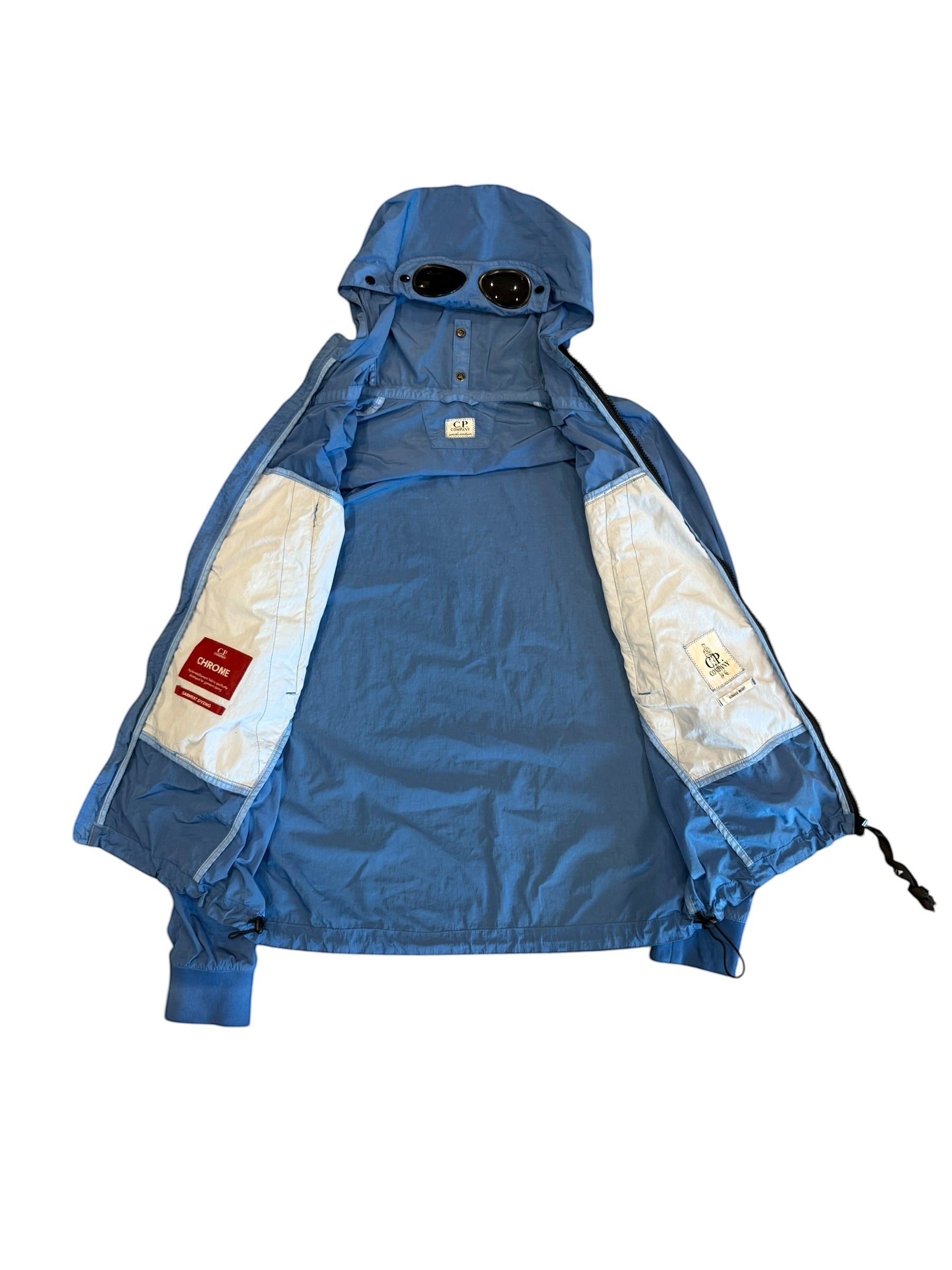 Archive No. 9 blue C.P. Company lightweight windbreaker jacket with iconic goggles on hood, size S.