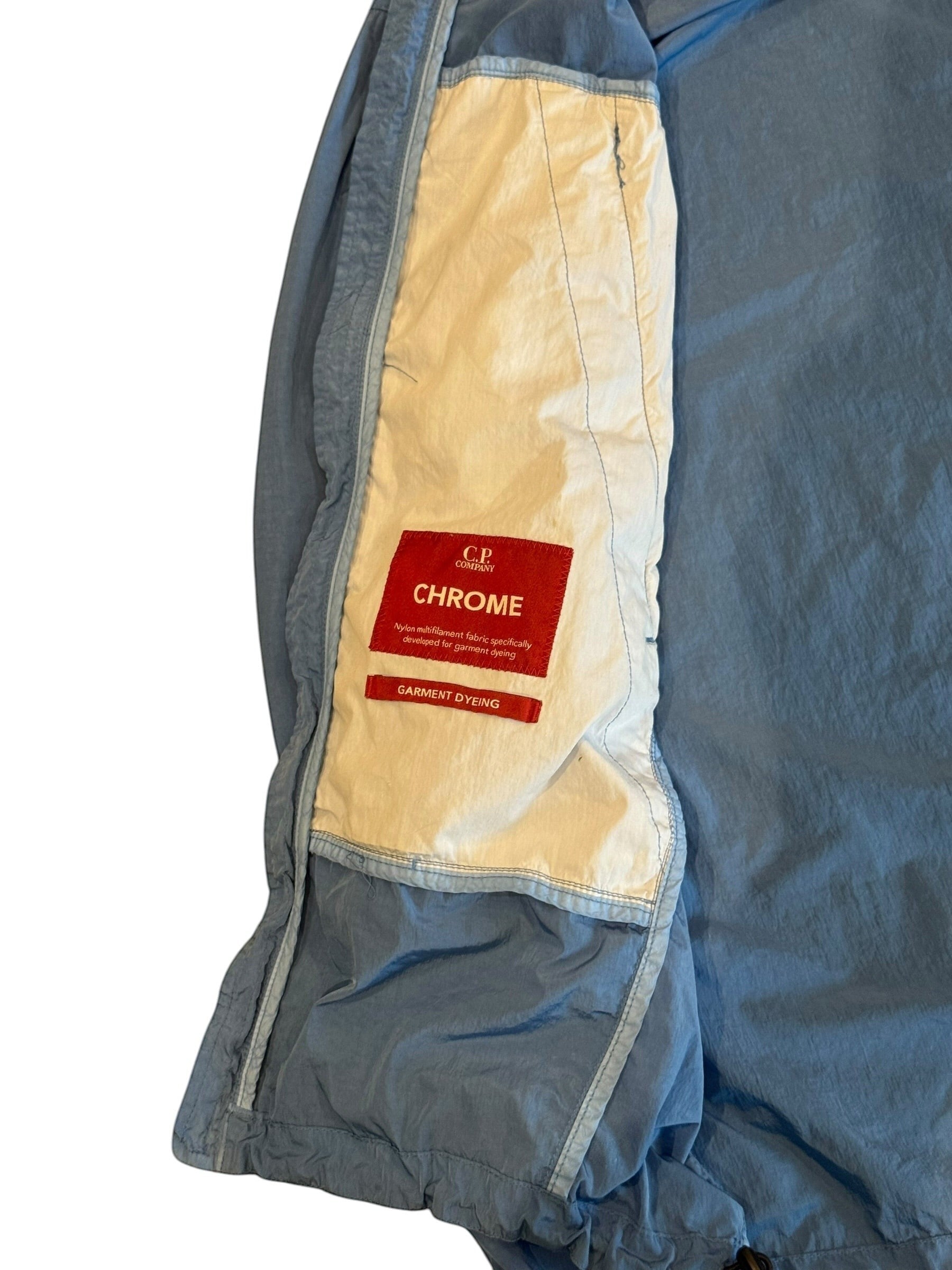 Archive No. 9 C.P. Company blue lightweight windbreaker jacket, size S, with waterproof protection and garment dyeing.