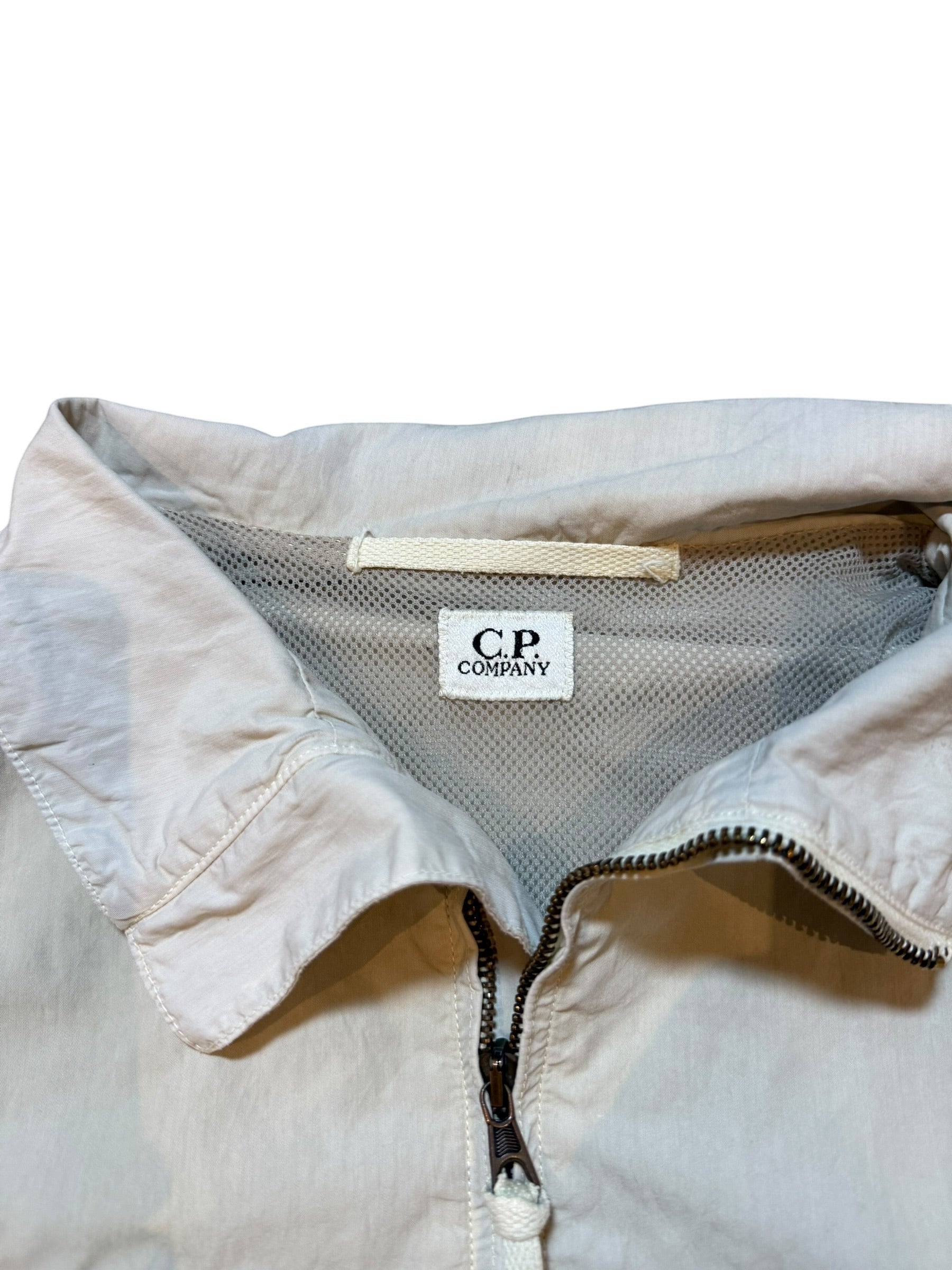 Archive No. 9 C.P. Company cream bomber jacket with mesh lining and zip closure. Vintage Italian garment.