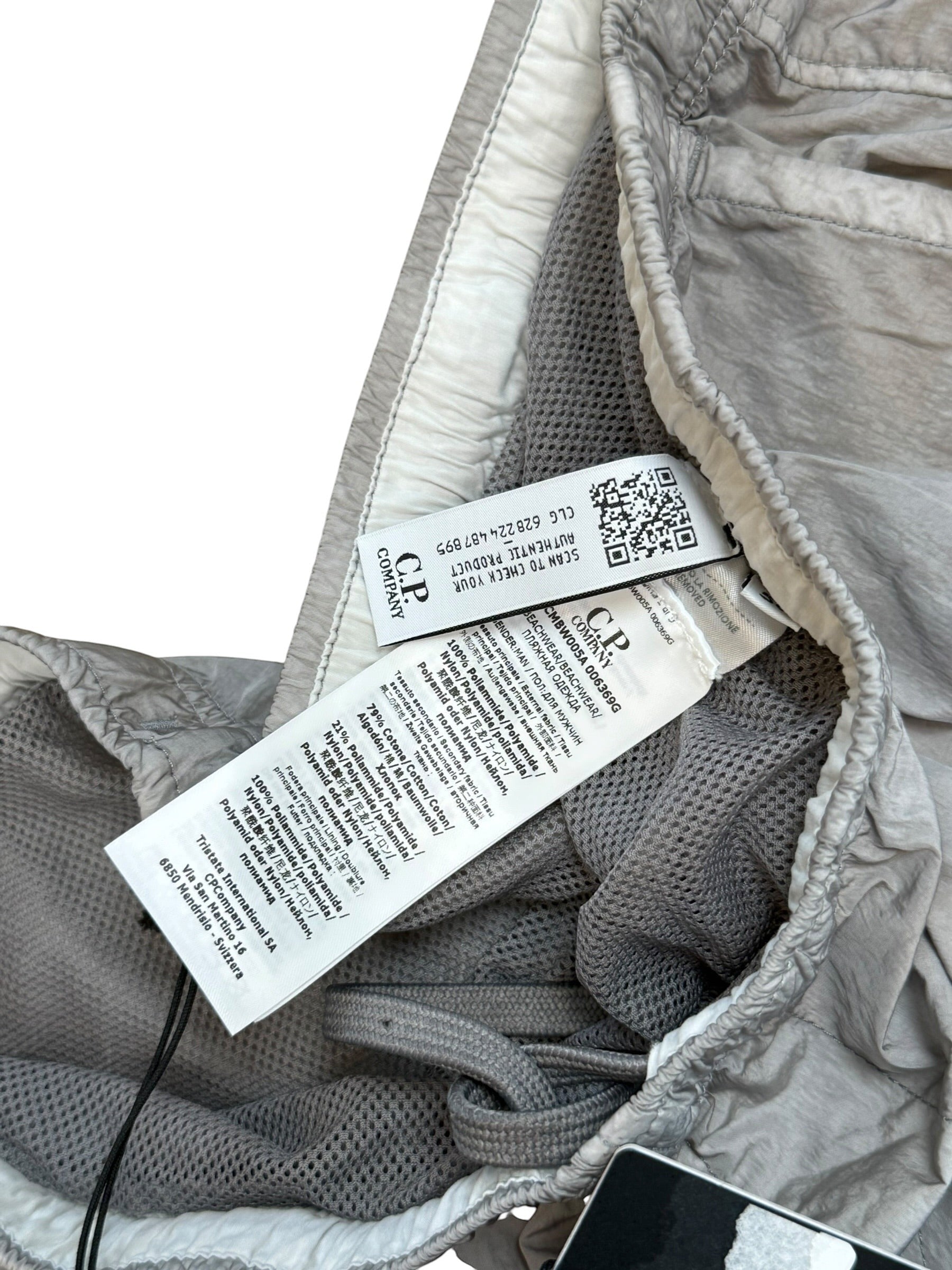 Archive No. 9 C.P. Company grey Chrome-R shorts with mesh lining and waterproof protection. Size L / W34.