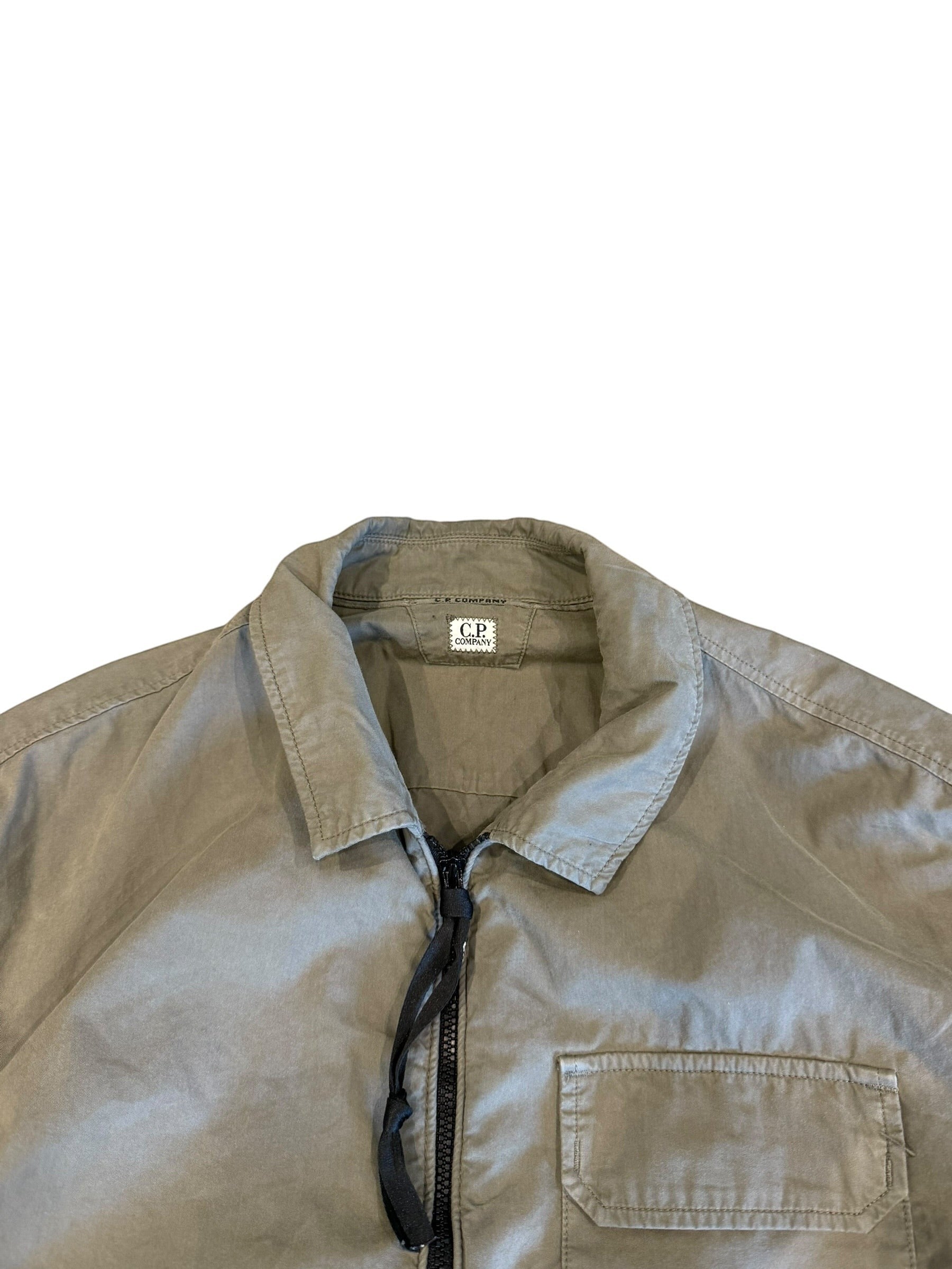 Archive No. 9 C.P. Company khaki lightweight zip-up overshirt with iconic arm lens detail, size Medium.