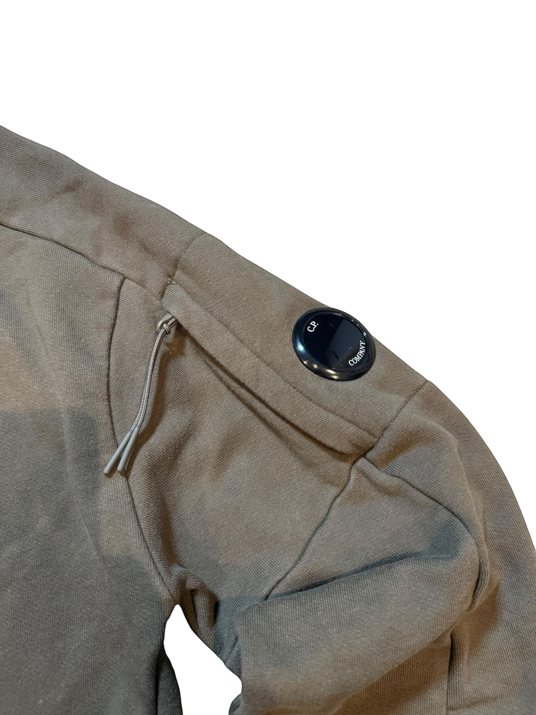 Archive No. 9 khaki C.P. Company sweatshirt with iconic lens detail on the arm and front pockets. Made in Italy.