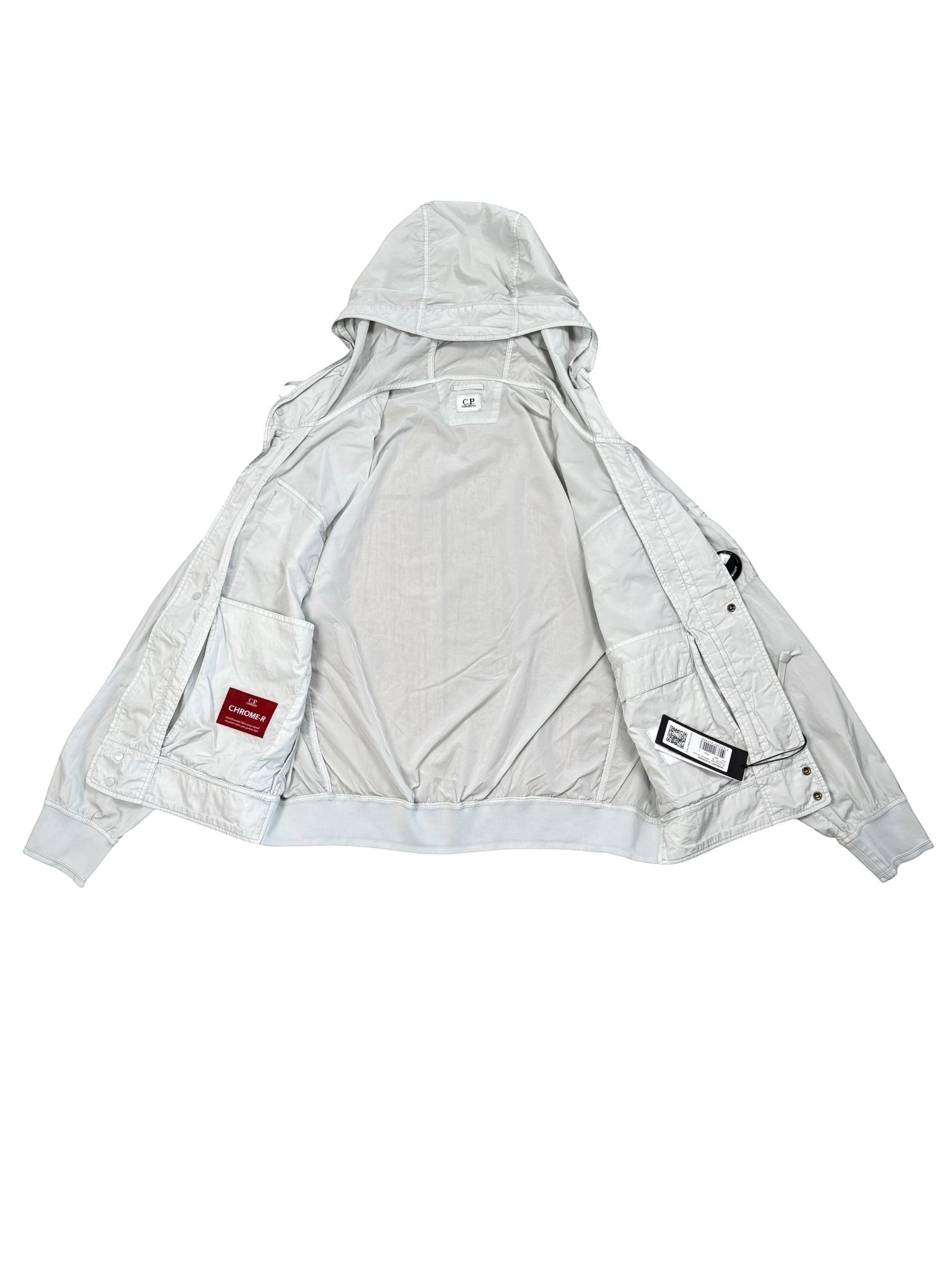 Archive No. 9 C.P. Company light blue Chrome R utility windbreaker jacket, size L. Features a hood, waterproof, and wind-resistant material.