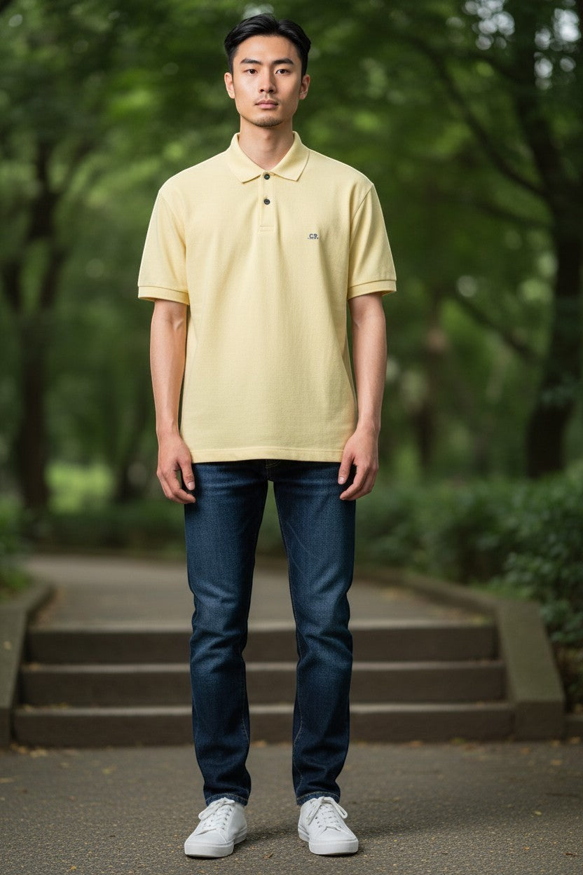 Archive No. 9 vintage C.P. Company mustard yellow cotton polo shirt, size L. Made in Italy.