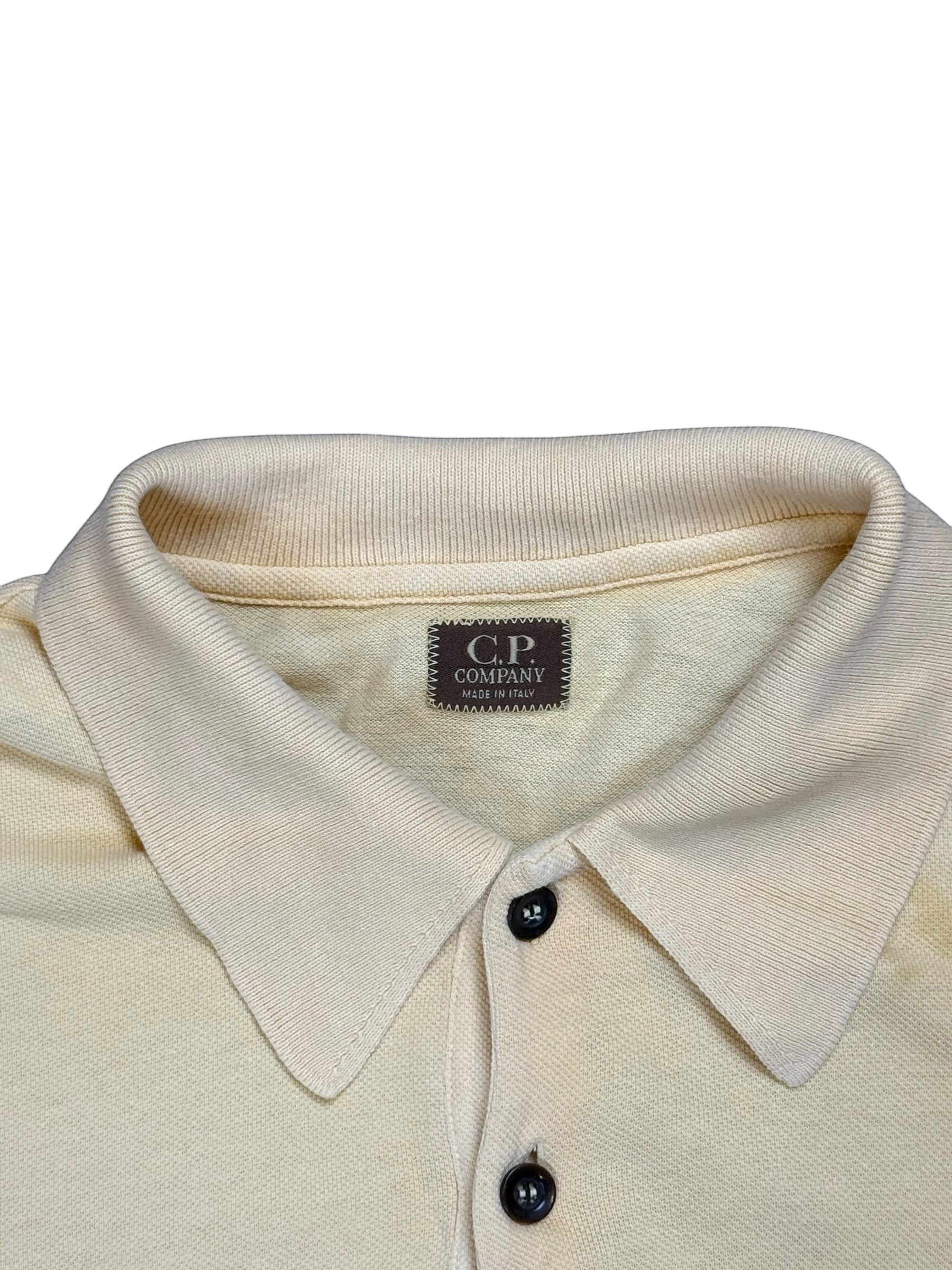 Archive No. 9 vintage C.P. Company mustard yellow polo shirt, size L, made in Italy. Features classic collar and two dark buttons.