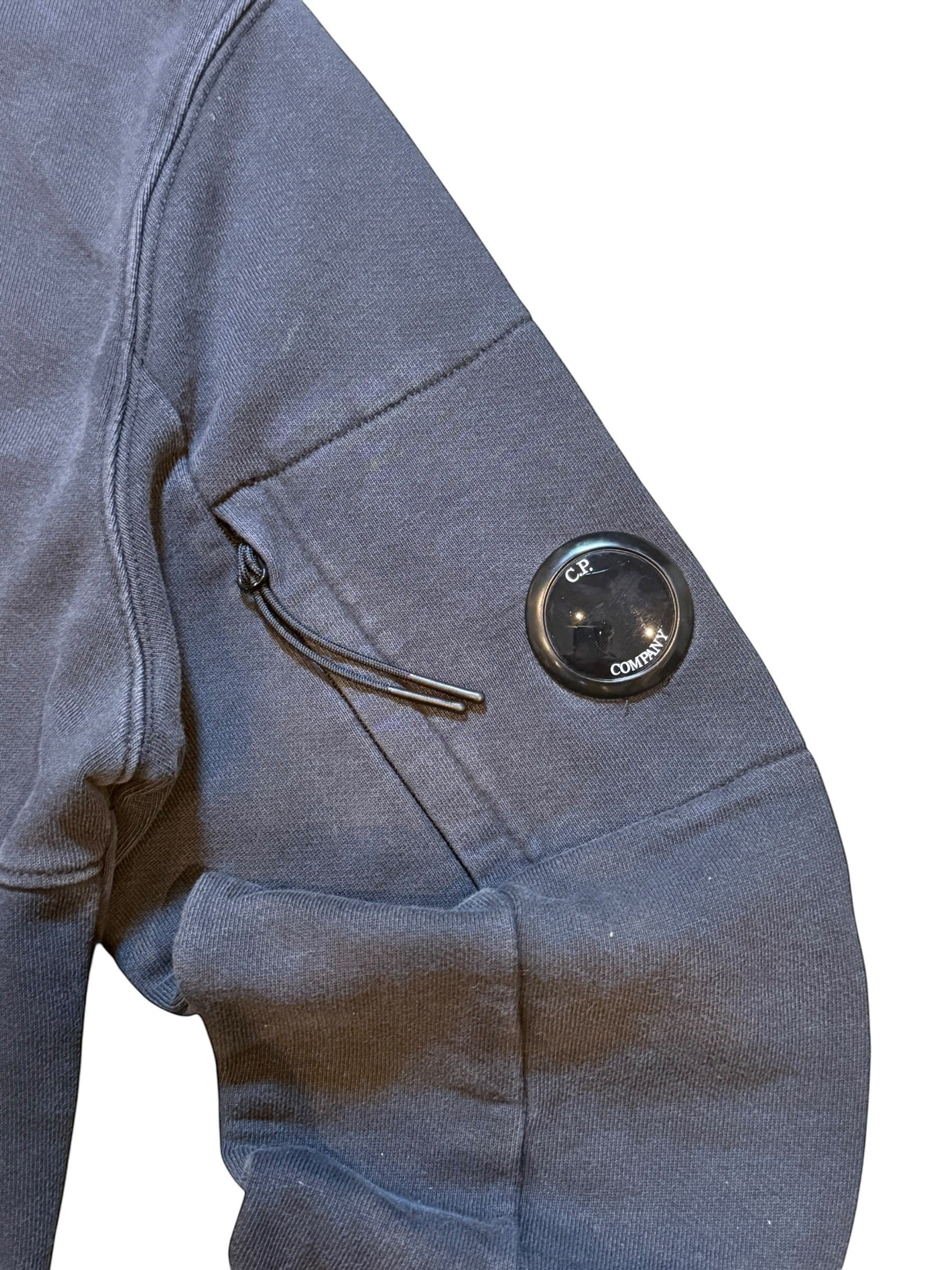 Archive No. 9 navy blue C.P. Company cotton hoodie with iconic arm lens and logo on hood. Size Small.
