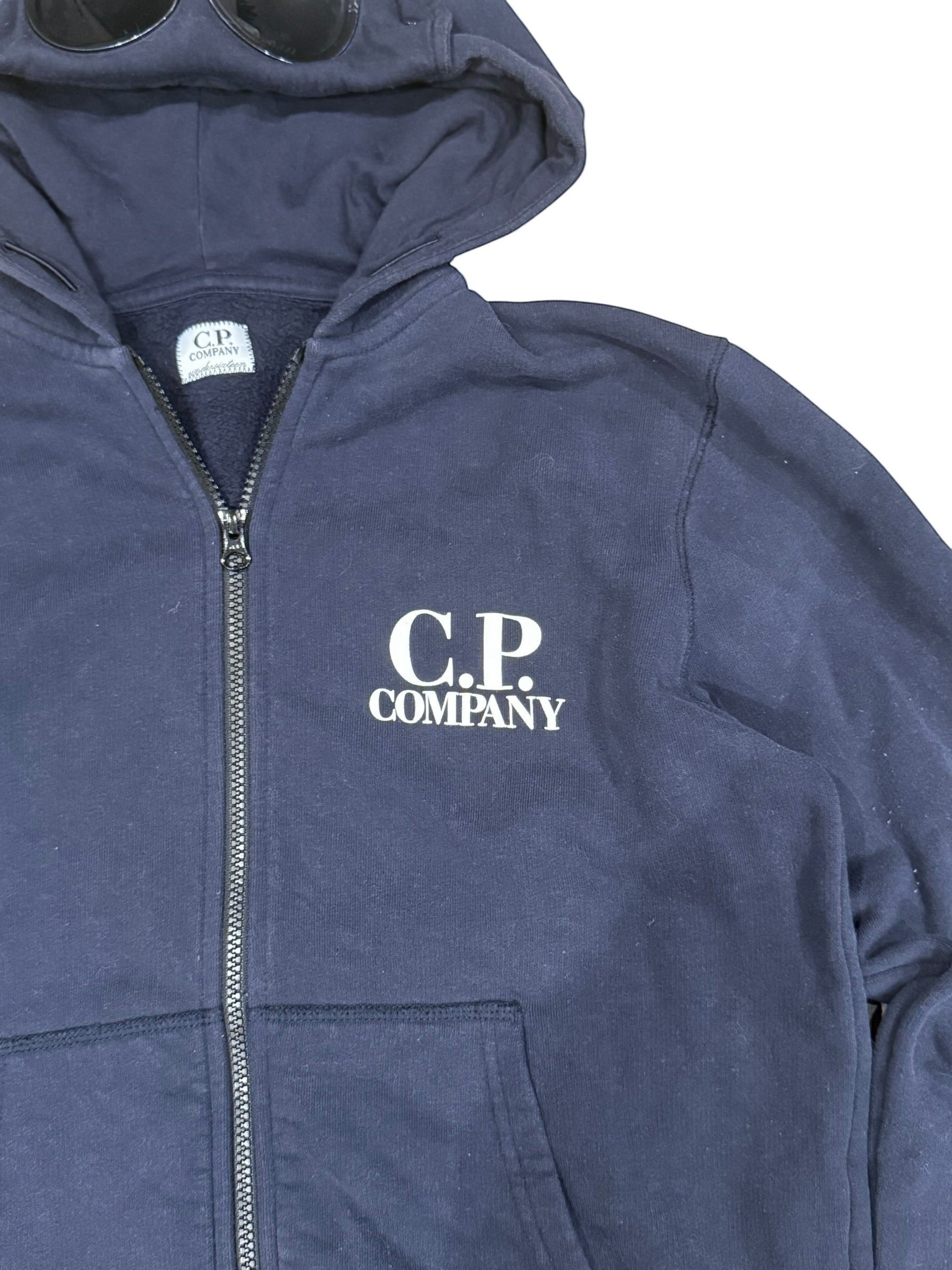 Archive No. 9 navy blue C.P. Company zip-up hoodie with iconic goggles on the hood and fleeced interior. Size Medium.
