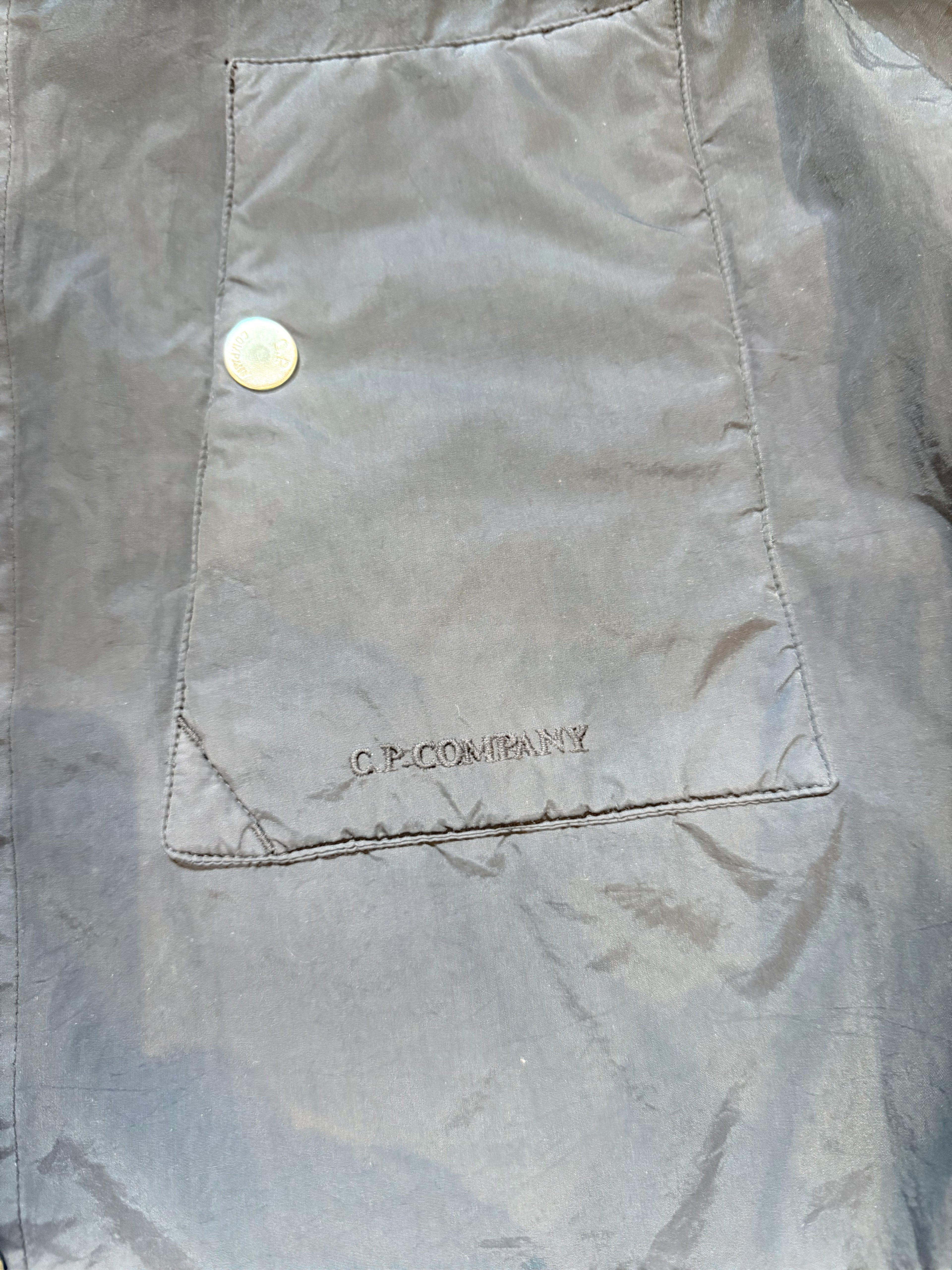 Archive No. 9 navy C.P. Company shell overshirt jacket with embroidered logo on chest pocket. Waterproof and wind-resistant.