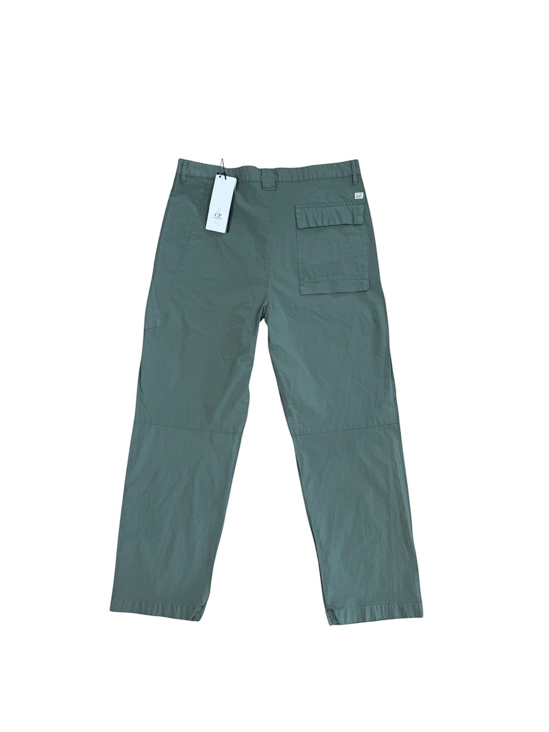 Archive No. 9 C.P. Company dark turquoise nylon lightweight baggy fit trousers with iconic lens detail.